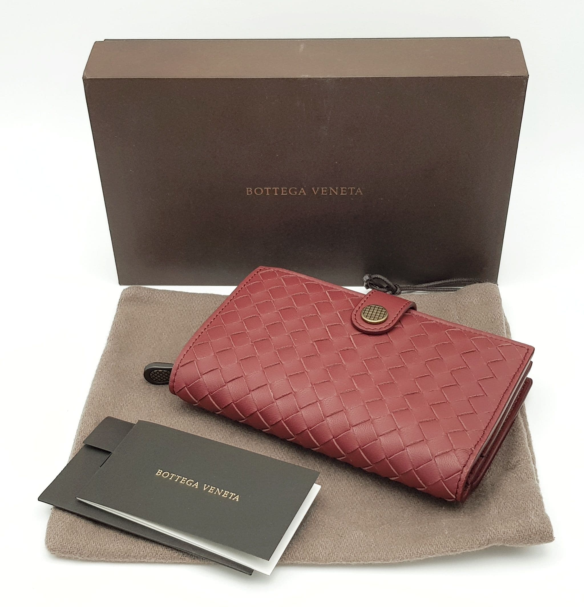 A Bottega Veneta Burgundy Intrecciato Leather French Wallet.