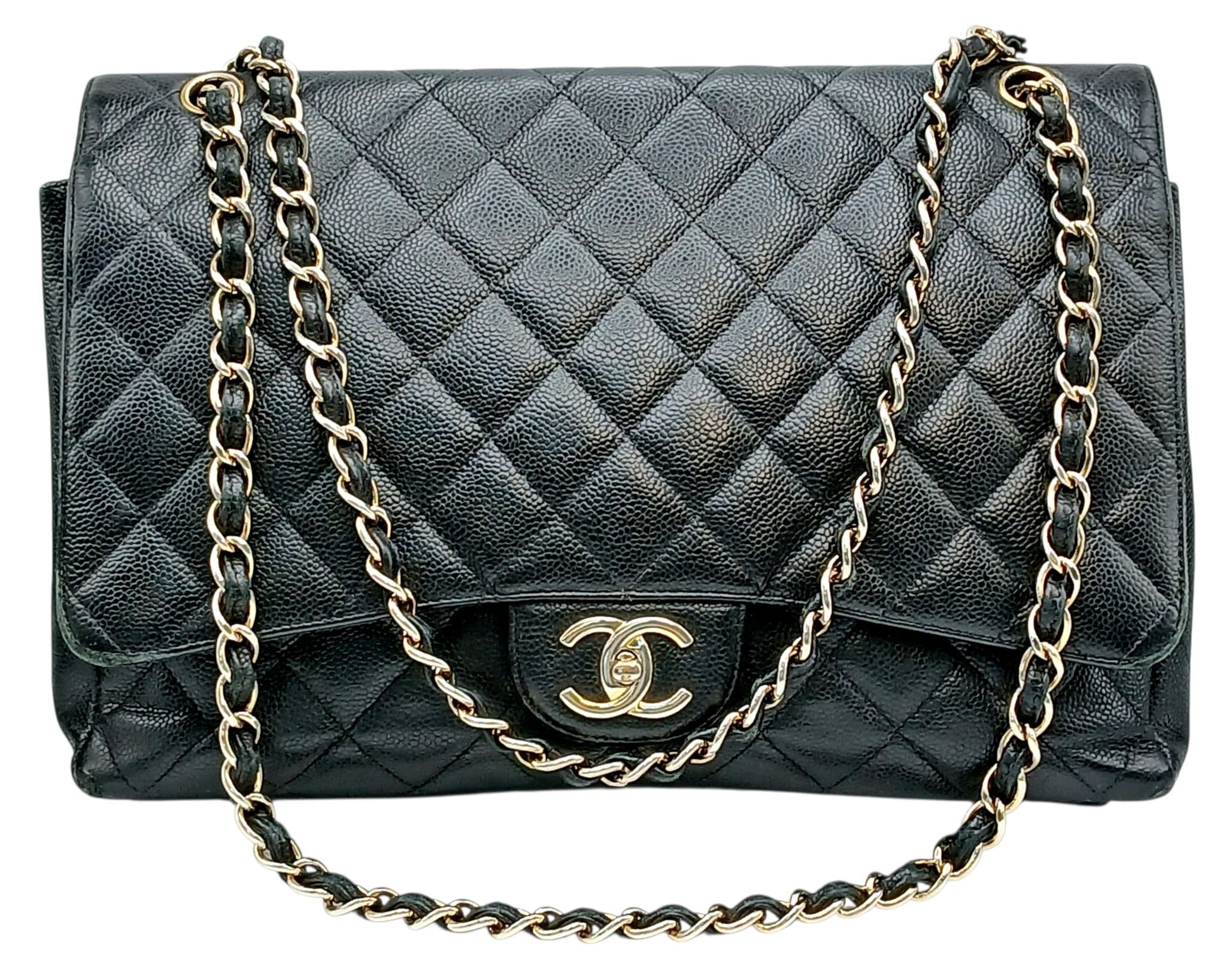 A Chanel Black Caviar Jumbo Single Flap Bag.