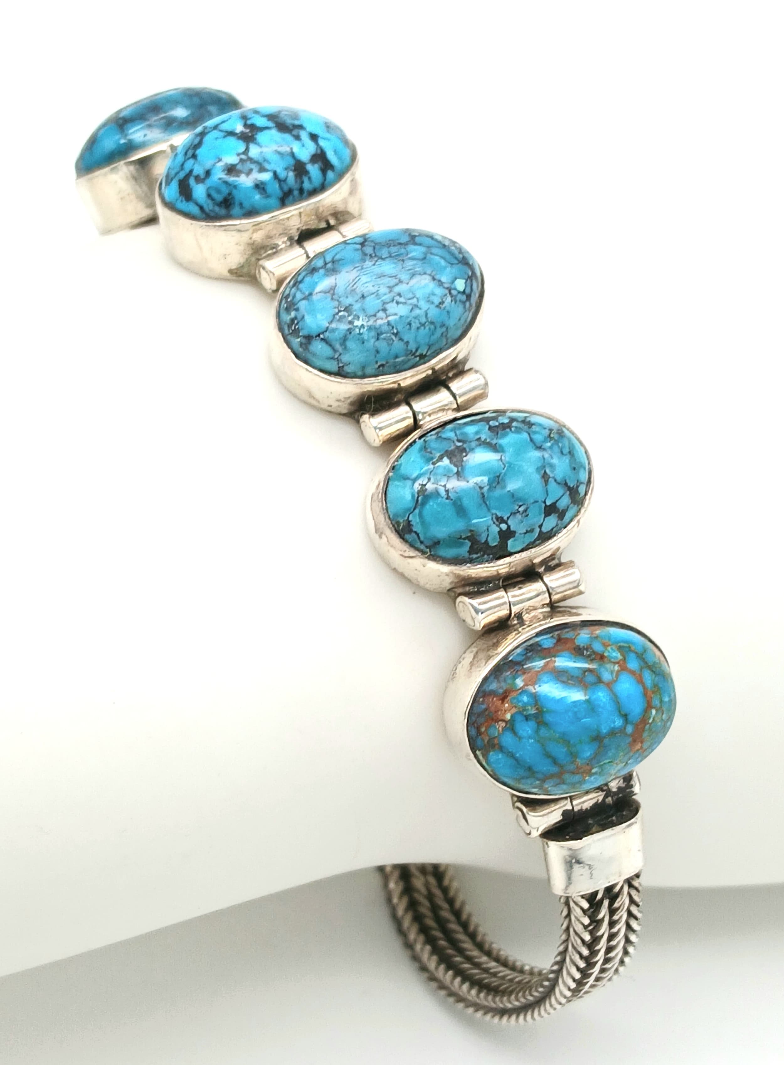 A Well-Crafted Vintage Silver and Turquoise Bracelet- Fits 19-21cm Length.Set with Five 1.4cm Long Turquoise Cabochons. Gross weight 24.84 Grams.