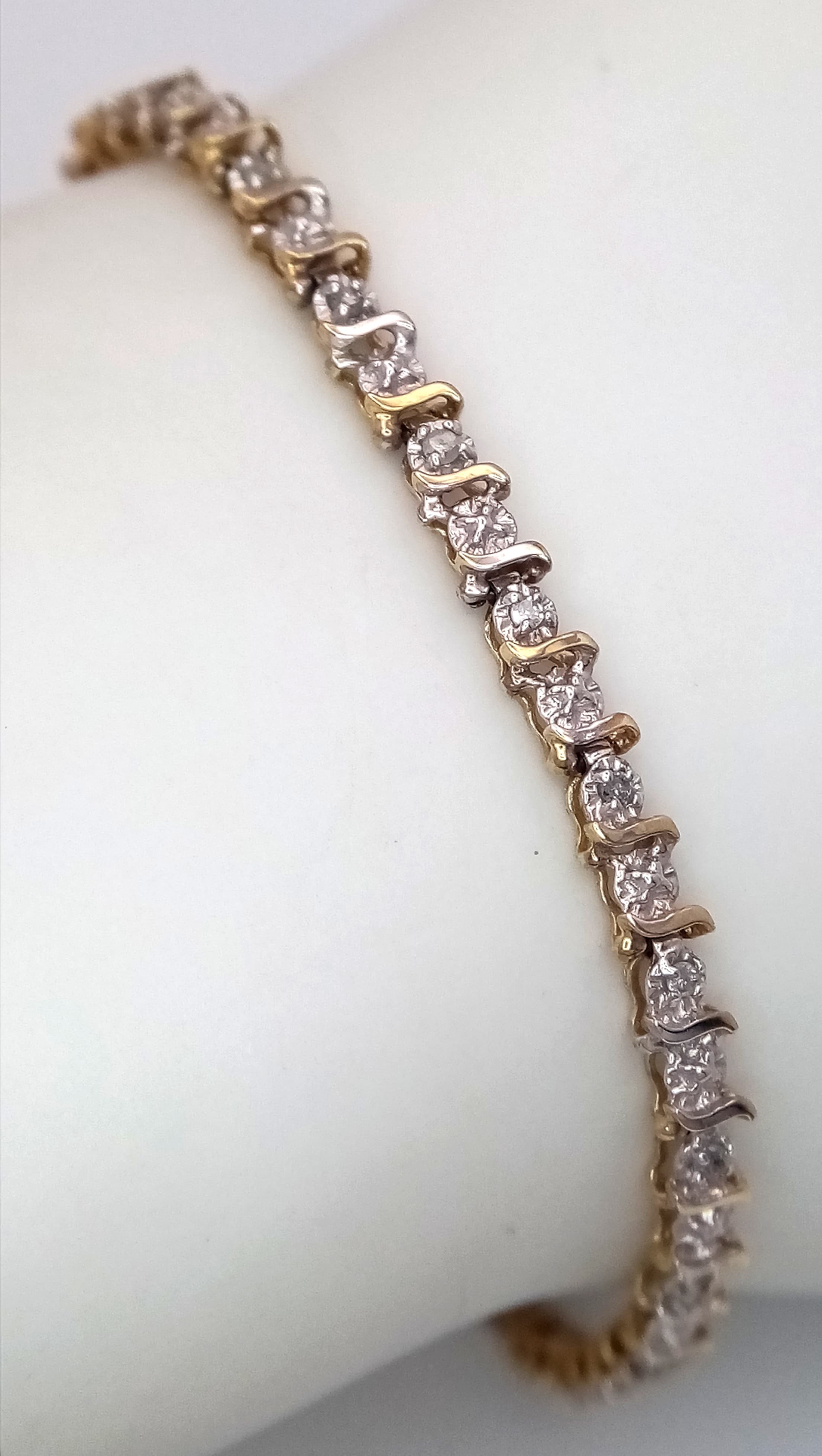 A 9K Yellow Gold Diamond Tennis Bracelet. 18cm. 4.48g.