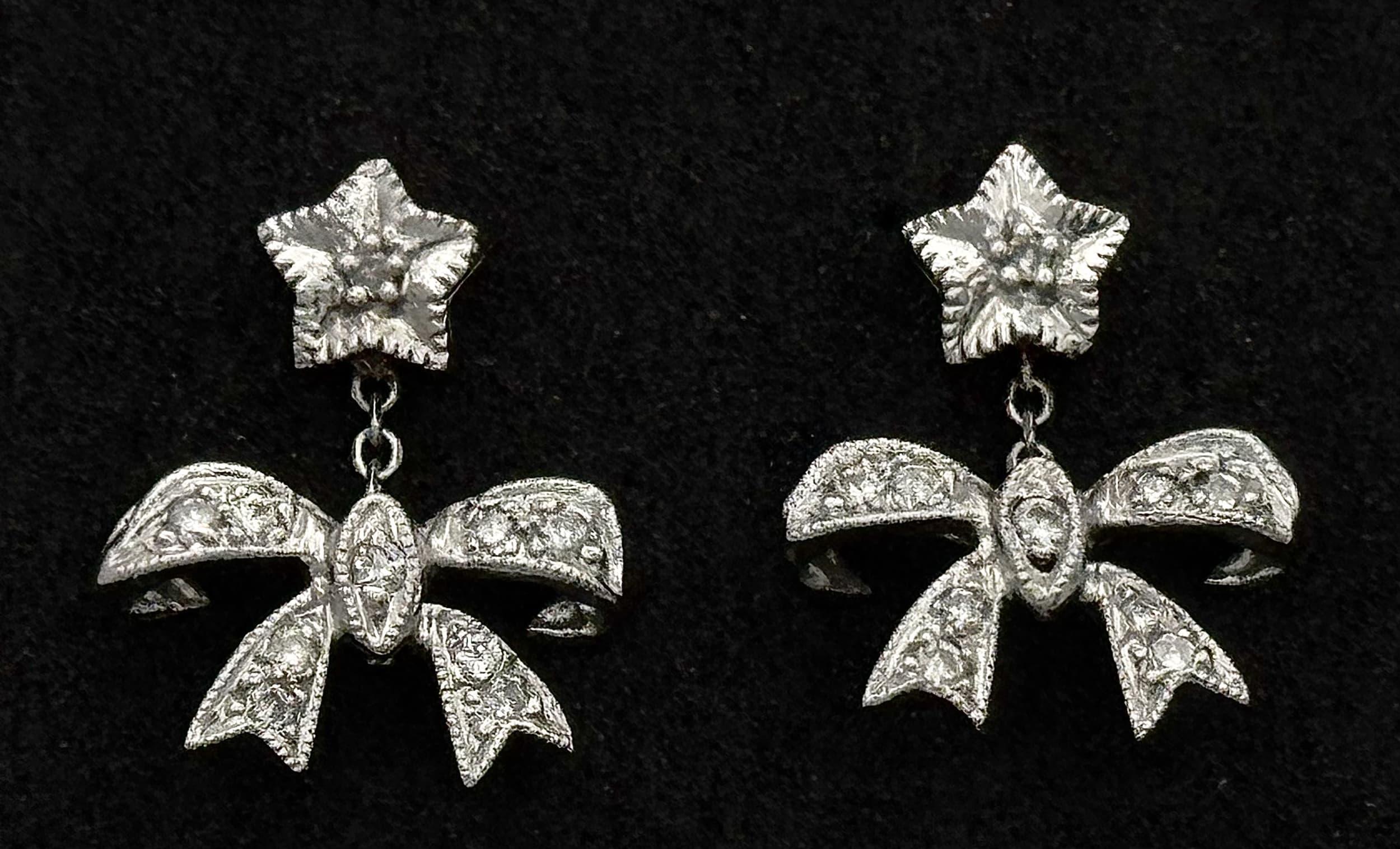A Pair of 14K White Gold Diamond Bow Drop Earrings. Earrings Hallmarked 14K, Butterfly Backs Hallmarked 585, Total Weight 1.79 Grams. Ref: 3-9