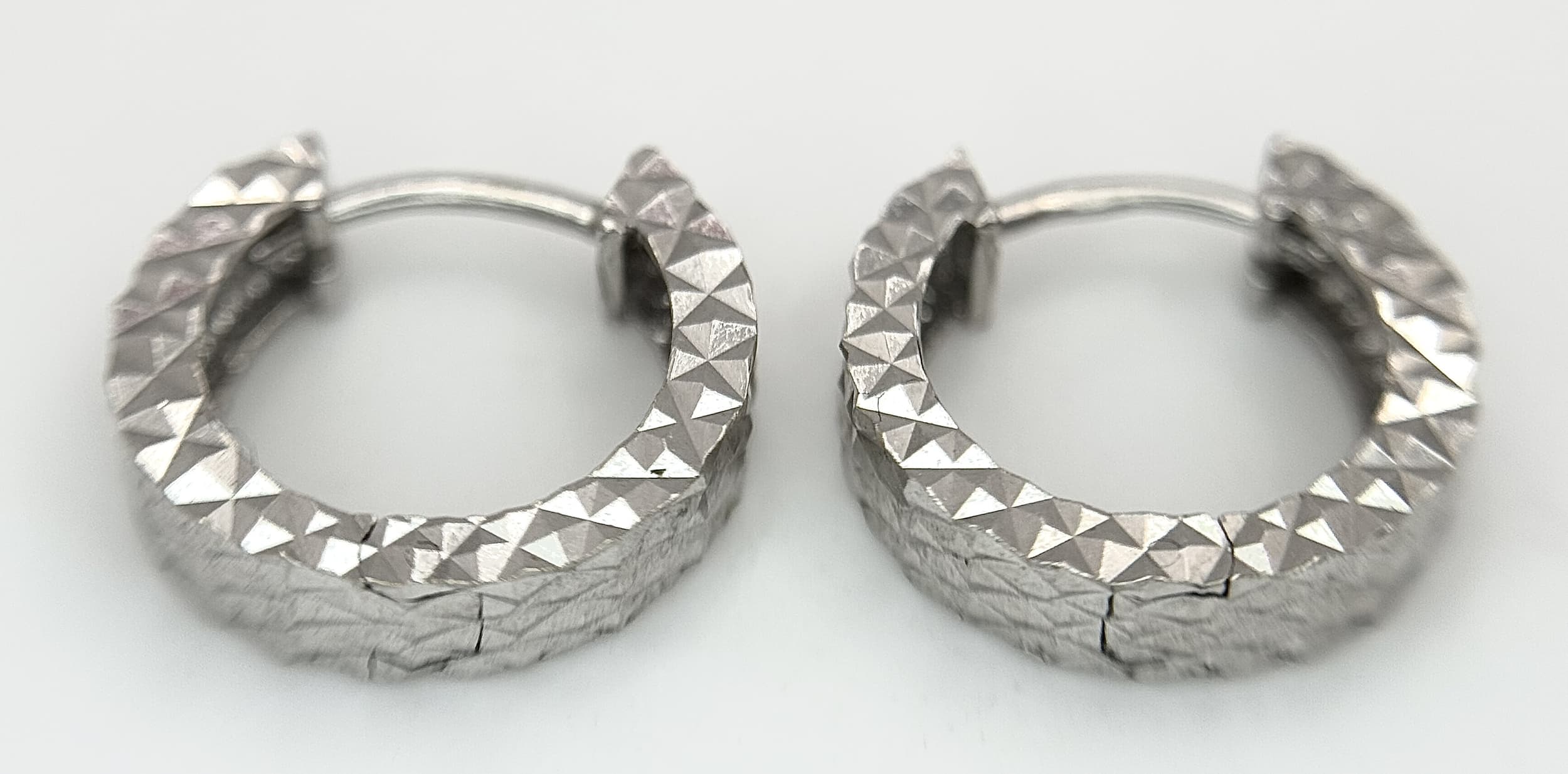 A Pair of 14K White Gold Diamond-Cut Huggie Earrings. Hallmarked 585, Total Weight 2.22 Grams. Ref: 3-6