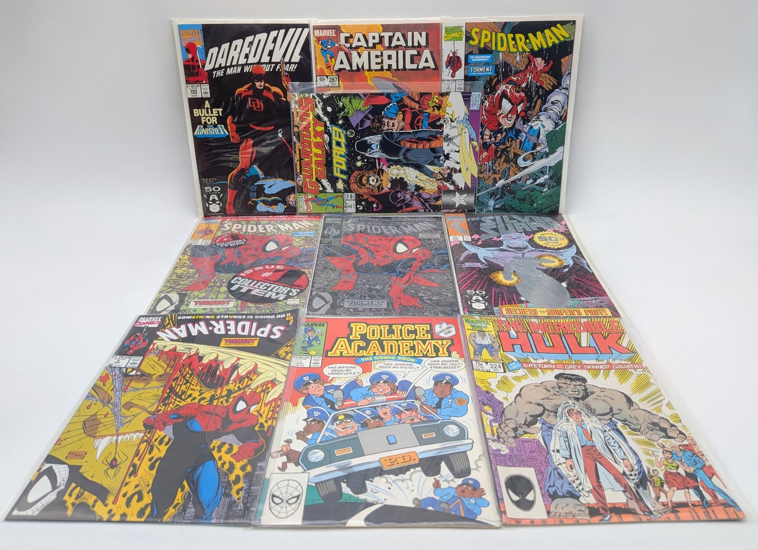 Ten Mixed Marvel Comics - All plastic wrapped. Please refer to photos for finer details.