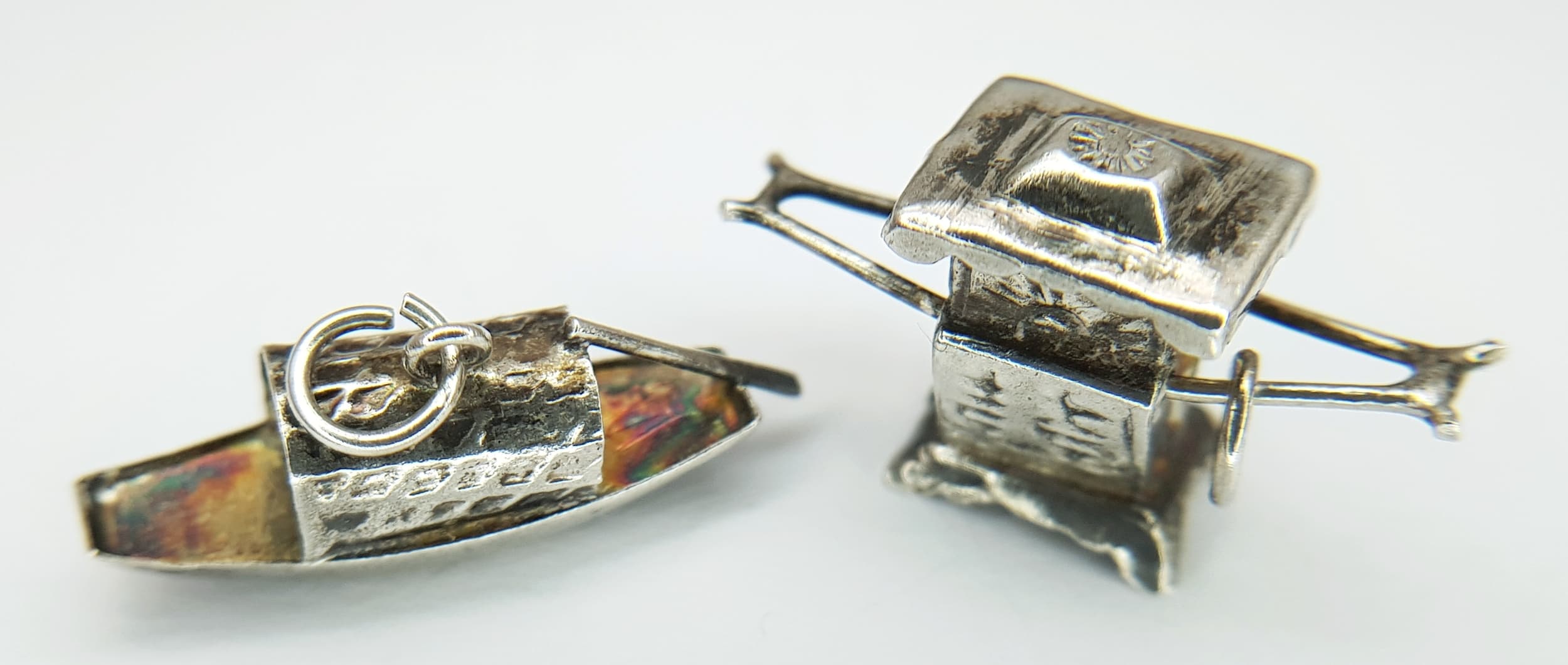 2X vintage Chinese silver boat and carriage pendants/charms. Total weight 1.4G.