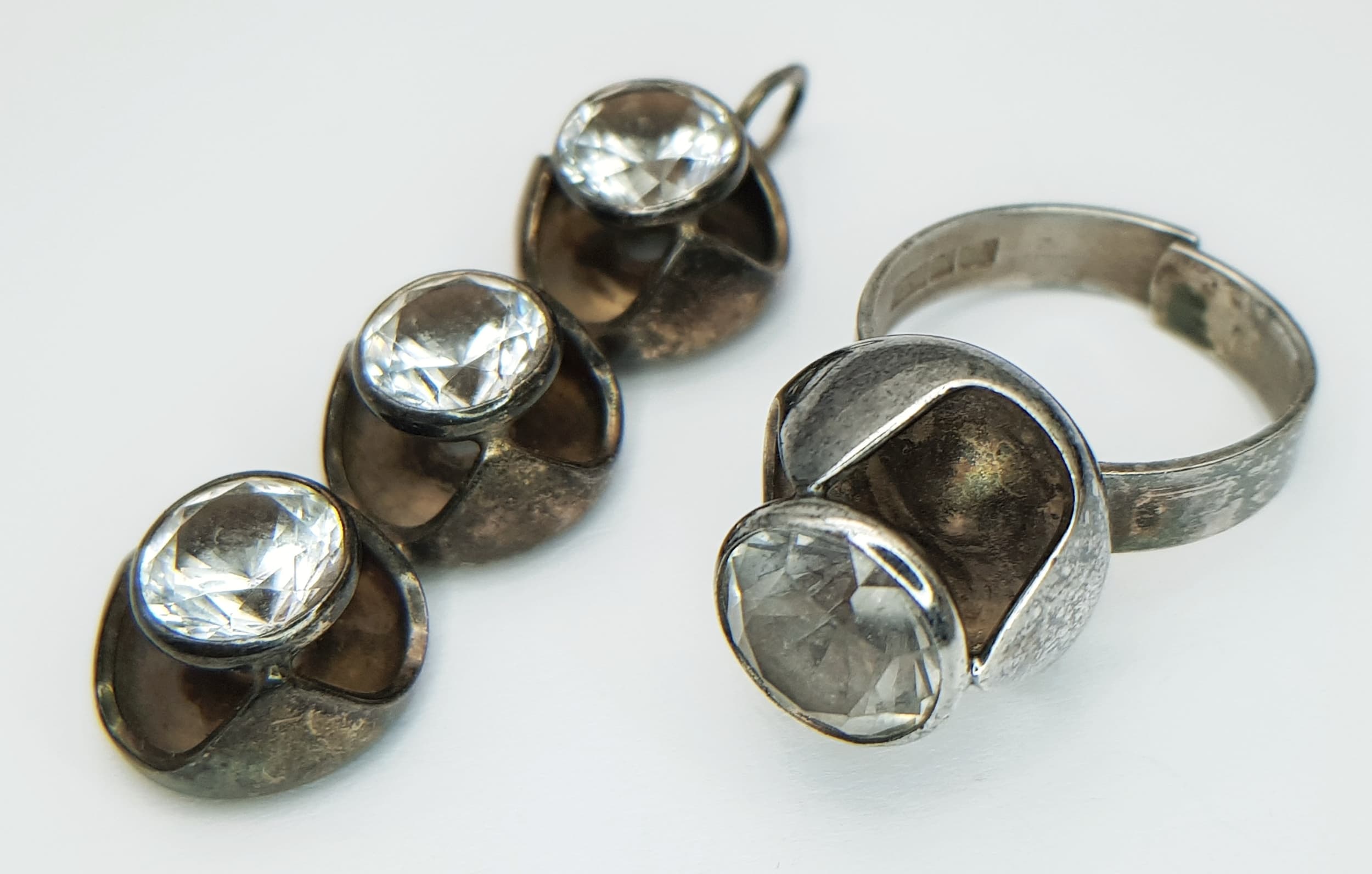 A vintage 925 silver matching set of stone set ring (Size L) and pendant (5cm) drop. Total weight 13.8G. Please see photos.