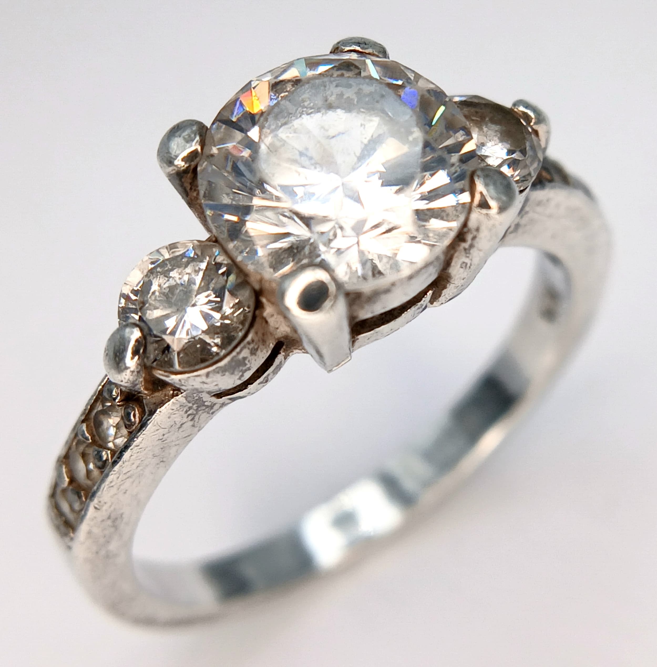 A 925 Sterling Silver Clear Stone Set Trilogy Ring. Size P. 4.08g.