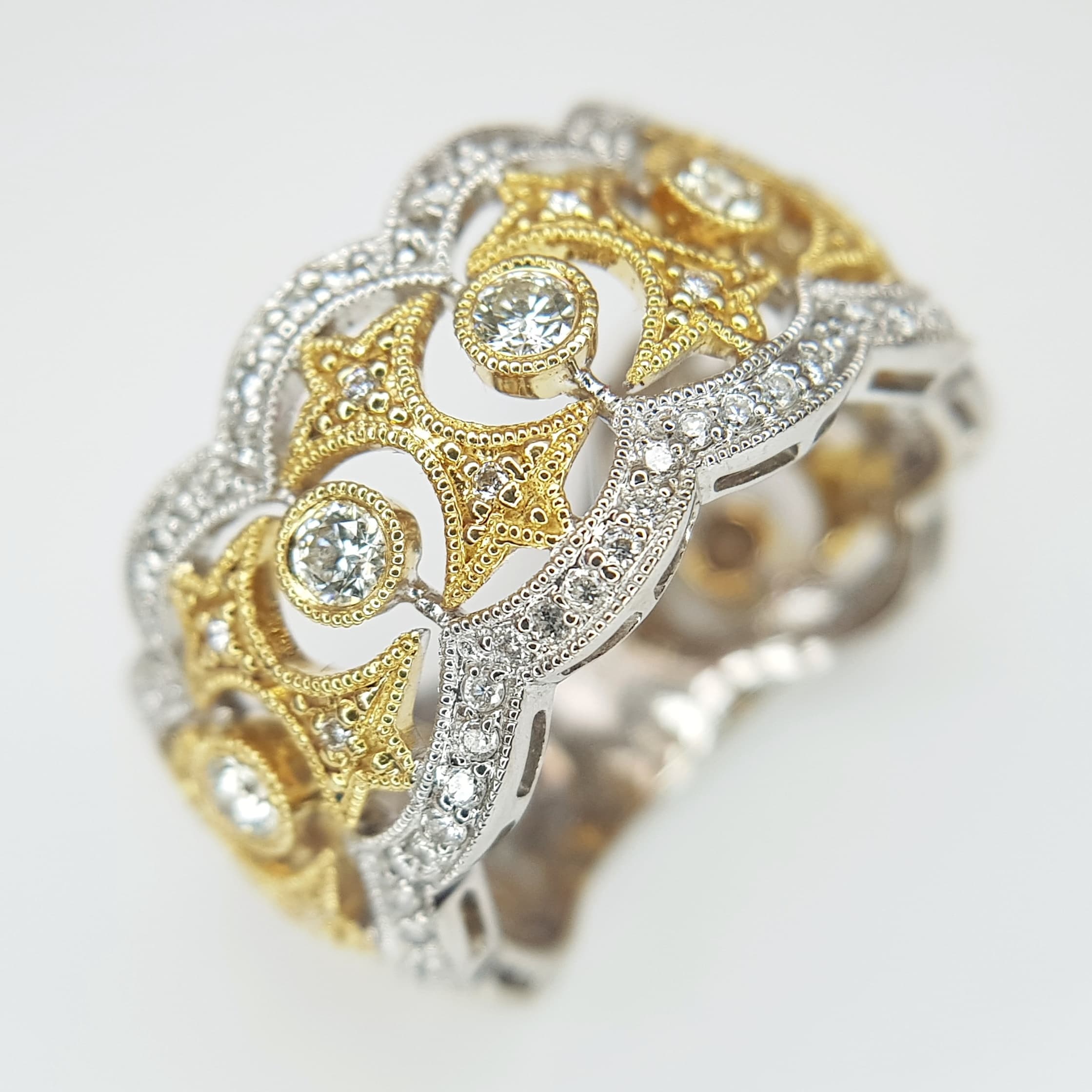 An Elegant 18K White, Yellow Gold and Diamond Dress Ring. Regal in nature with wonderful openwork and 0.95ctw of round brilliant cut diamonds having G-H colour and VS2 clarity. Size M. 8.47g total weight. Ref: 5.11