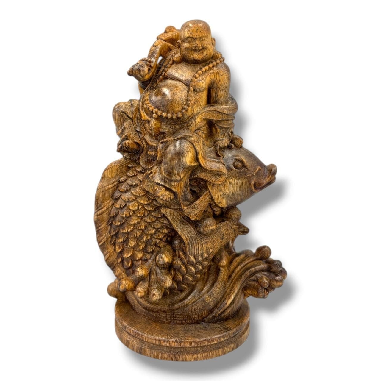 A hand Carved natural Agarwood Laughing Buddha on Fish Figure. The natural agarwood fragrance is well known for its purposes in relaxation and meditation. Some signs of surface wear, natural wood grain variation, light marks and darker areas throughout. Approx 18cm height x 11cm width. Please see photos or request a condition report. This item is held at Cadmore ASIAN Office in Vietnam and will be shipped from there. Buyers will be responsible for direct shipping payments. Delivery will take slightly longer.