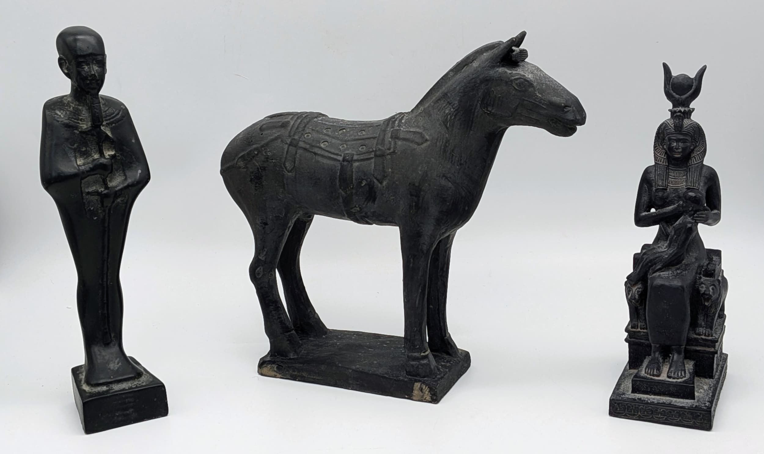 Three Vintage Cast Statuettes Comprising 1) A Replica of a Qin Dynasty Terracotta Army Horse-22cm Tall. 2) The Egyptian Deity ‘Ptah’.The God of Craftsman and Creation-22cm Tall and 3) The Egyptian GoddessIsis nursing her son Horus-19.5cm tall.