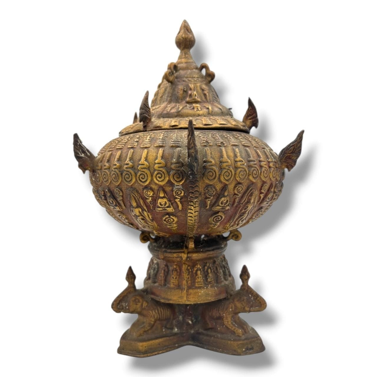 An antique Asian bronze Ritual Jar with Cover. Engraved decorative motifs, pointed hardware detailing, four-footed base and removable lid closure. Some signs of age and wear, surface tarnishing, oxidation and residue marks throughout - please see photos for condition. Approximately 17cm width x 19cm height without lid x 31cm height with lid. Please see photos or request a condition reportThis item is held at Cadmore ASIAN Office in Vietnam and will be shipped from there. Buyers will be responsible for direct shipping payments. Delivery will take slightly longer.