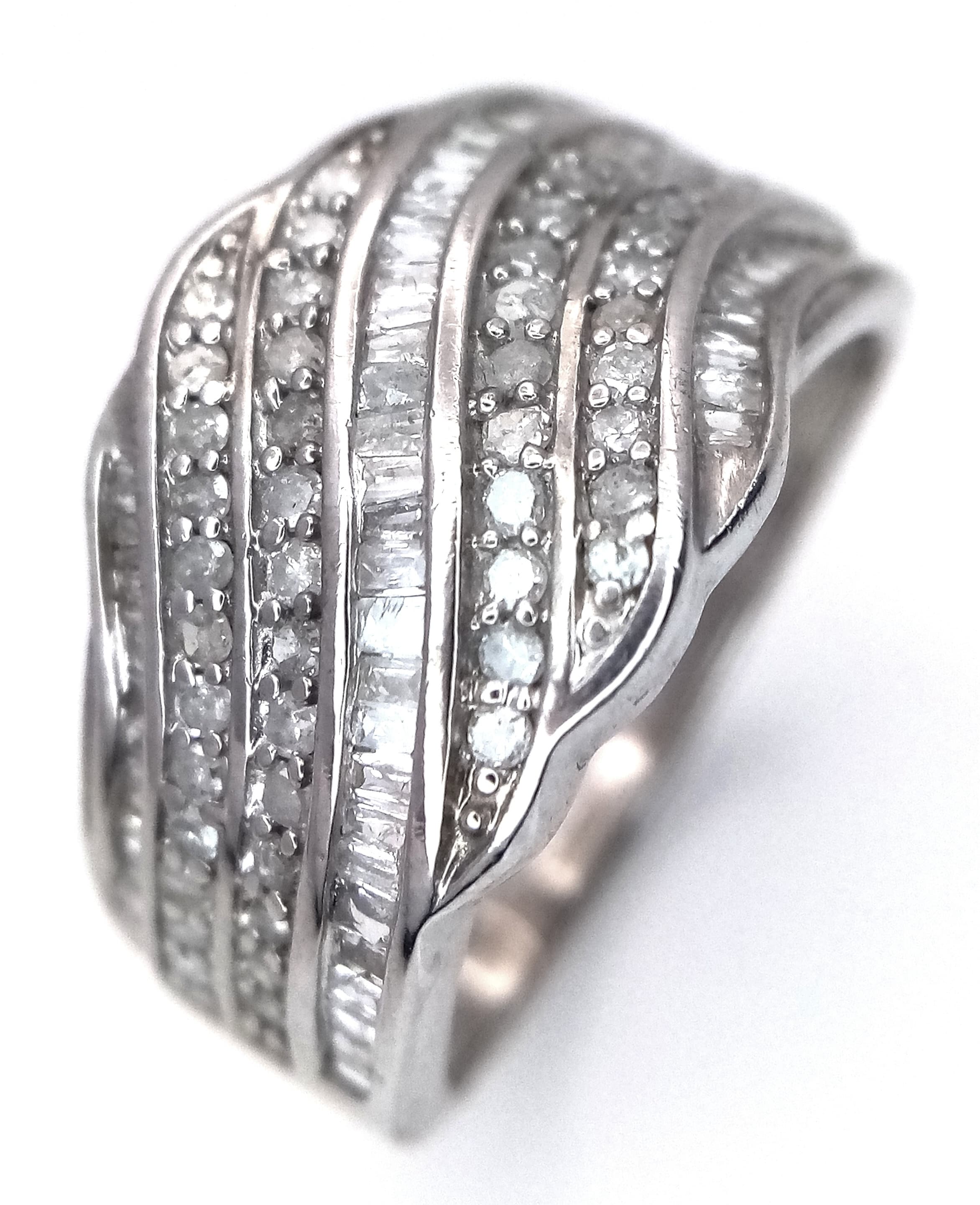 A 9K White Gold Diamond Ring. 0.60ctw diamonds, 3.9g total weight, ring size N. Ref: SH8260H