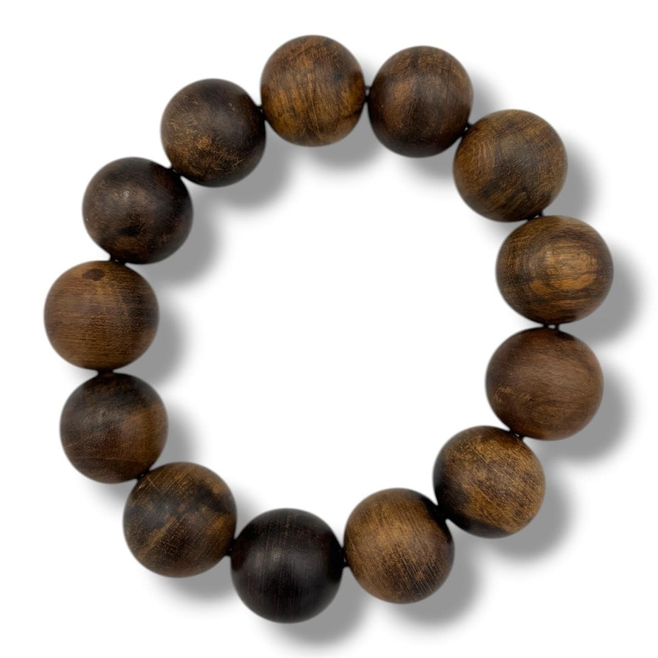 A vintage Natural Agarwood round Bead Bracelet.The natural agarwood fragrance is well known for its purposes in relaxation and meditation.Some signs of wear and natural surface variation throughout - please see photos for condition. Approximately 8cm internal diameter. Please see photos or request a condition report.This item is held at Cadmore ASIAN Office in Vietnam and will be shipped from there. Buyers will be responsible for direct shipping payments. Delivery will take slightly longer.