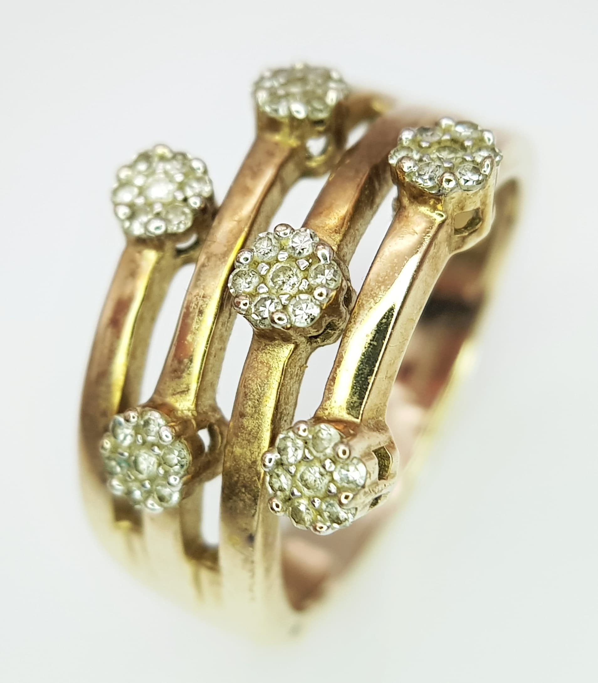 A 9K Yellow Gold Starburst Diamond Ring. Size R 1/2, 5.98g total weight.