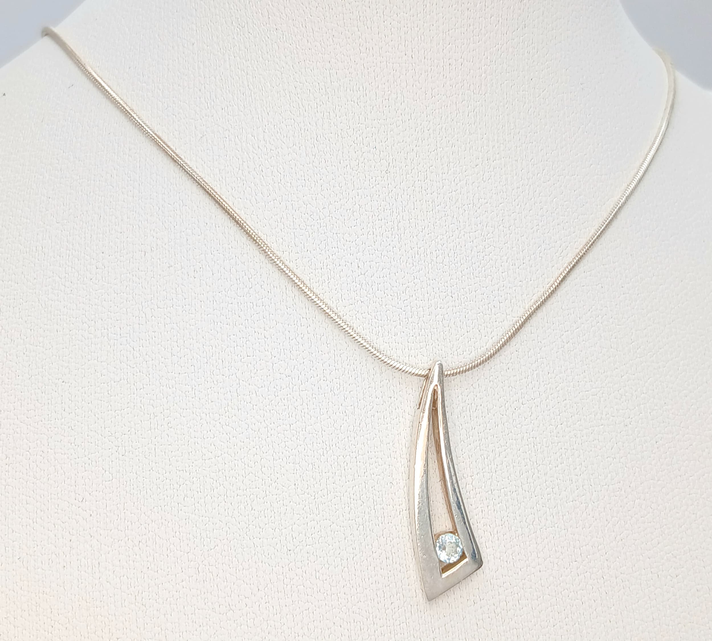 A 925 silver stone set modern design pendant necklace. Total weight 4.8G. Total length 40cm.