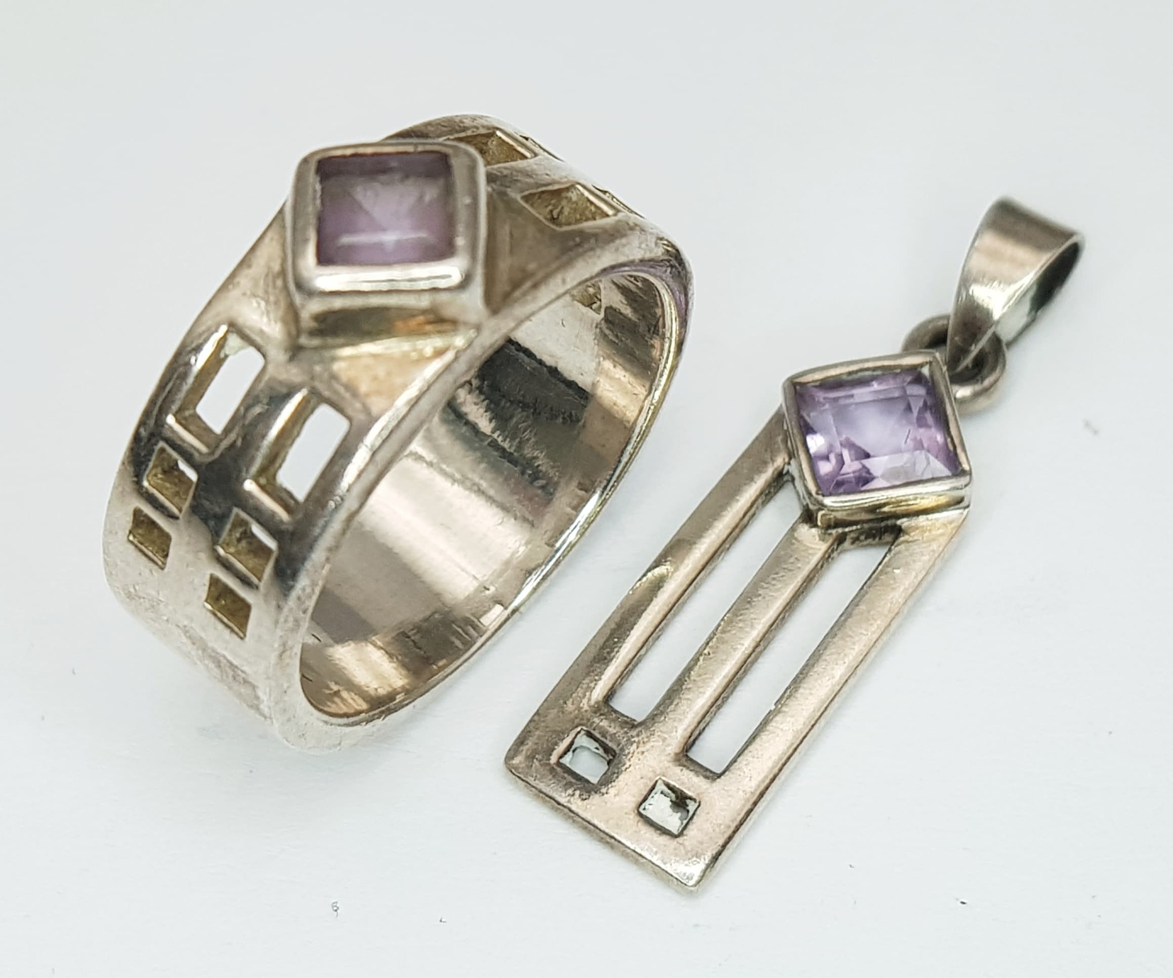 A matching set of 925 silver Celtic Amethyst solitaire ring and pendant. Ring size N. Total weight 9.9G.