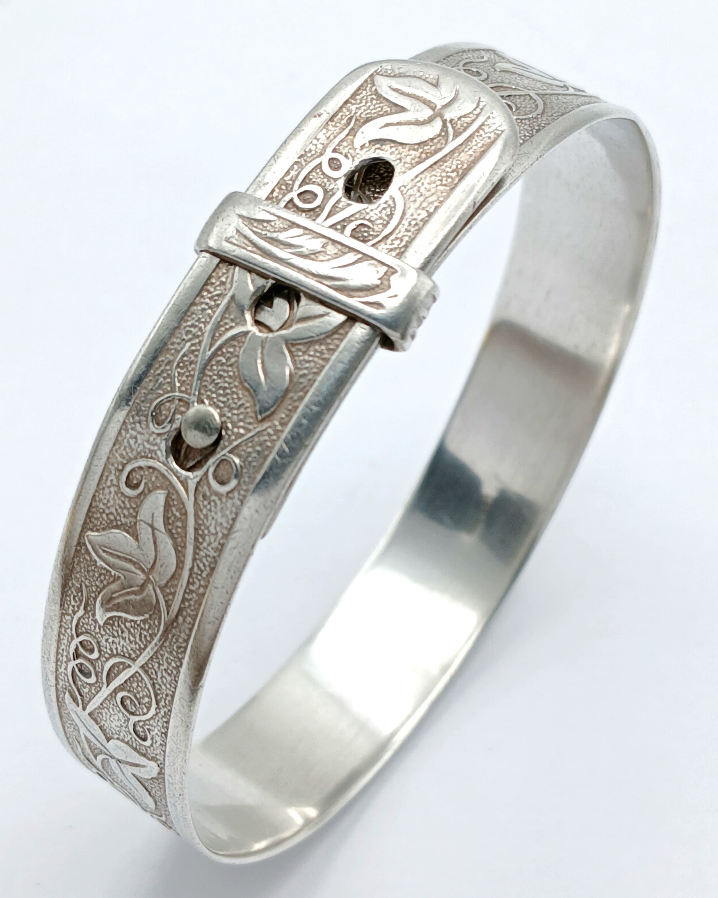 A Vintage Silver Adjustable Bangle-6cm Diameter. The Bangle features an Ornate Floral and Scroll Engraved Design with an Adjustable Sliding Fastener. Gross weight 20.45 grams.
