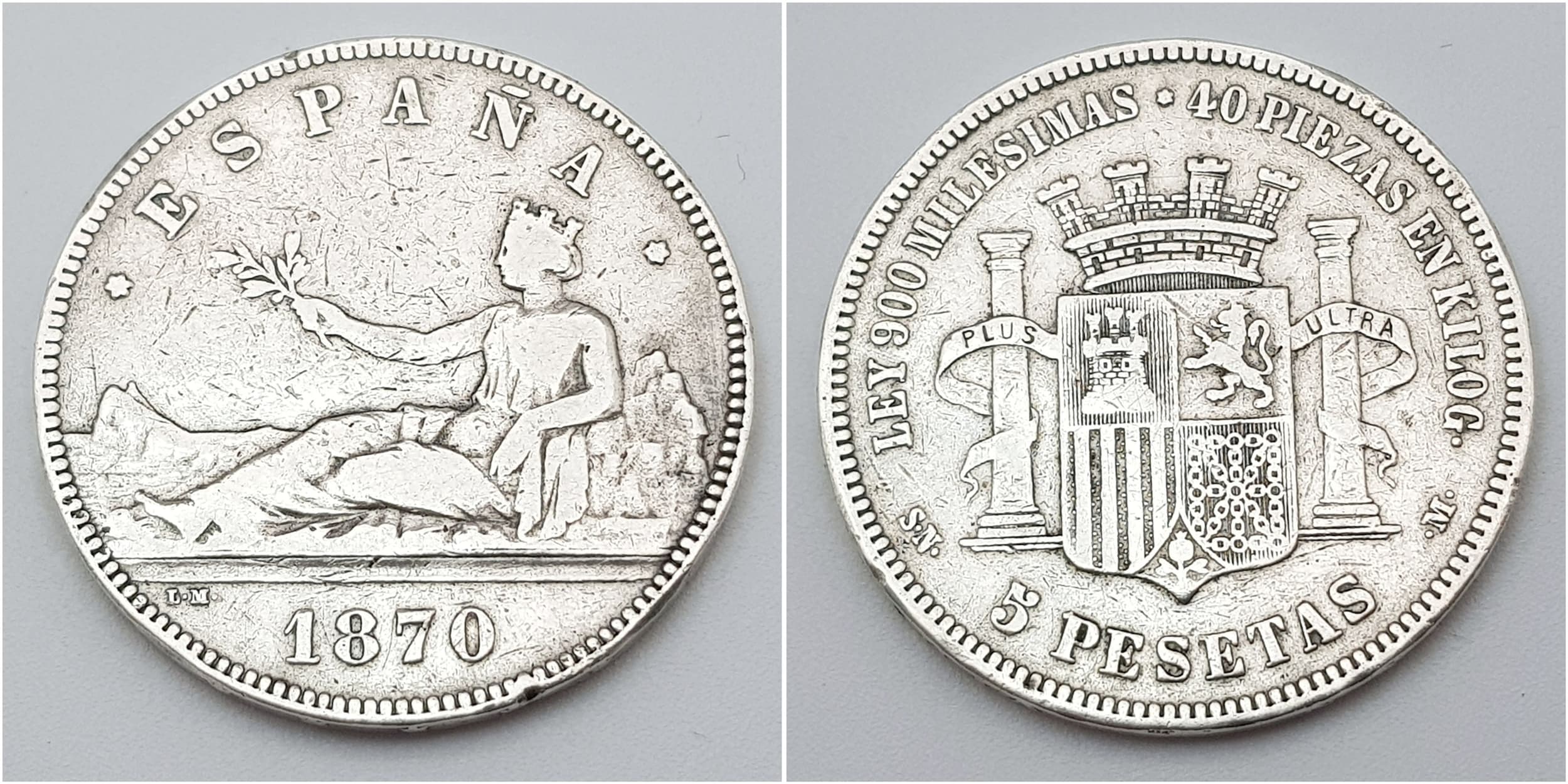 An 1870 Spanish Amadeo Silver (900 Purity) 5 Pesetas Coin. Minted during the short reign of King Amadeo I of Spain (1870-1873). 24.75g. Please refer to photos for condition.