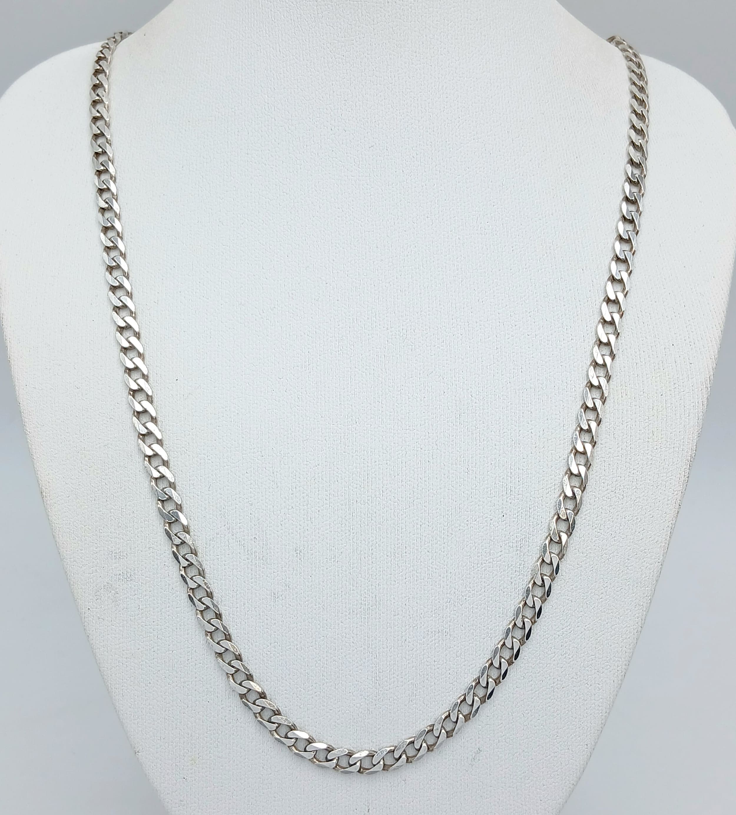 A 925 Sterling Silver Curb Link Chain Necklace-50cm Length. The Necklace has a gross weight of 15.8 grams.