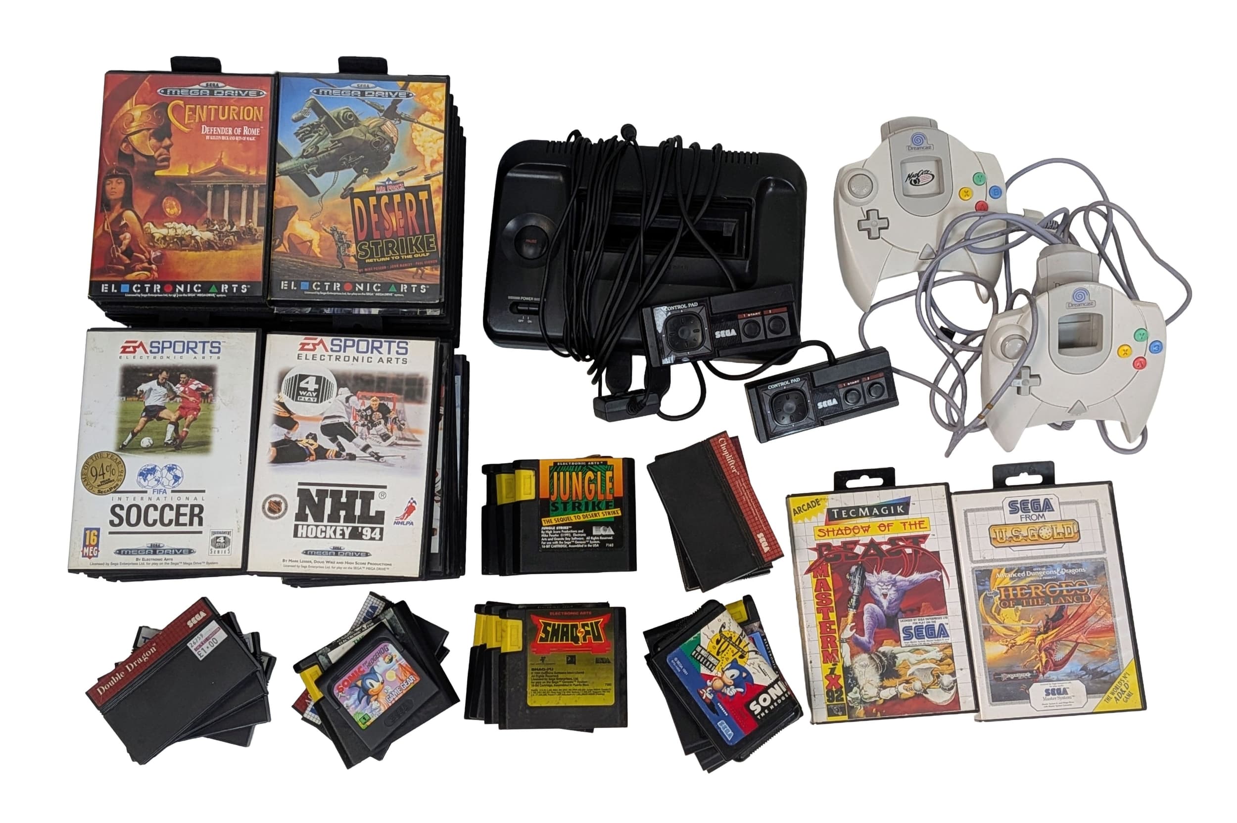 A vintage Sega gamers bundle. To include a Master System console, two Dreamcast controllers and a stack of games. As found.