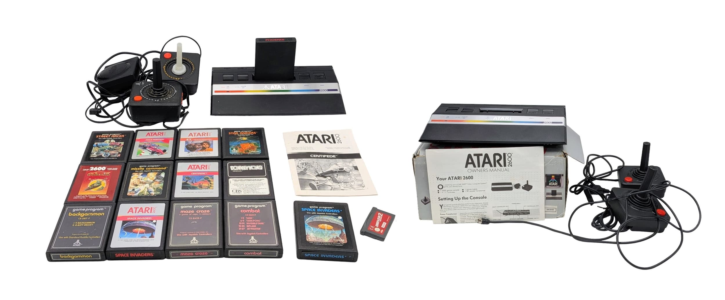 A vintage Atari gamers bundle. To include a 2600JR video computer system in its original box, with two joysticks and a loose 2600JR system with two joysticks. No power cables. And a selection of games. As found.