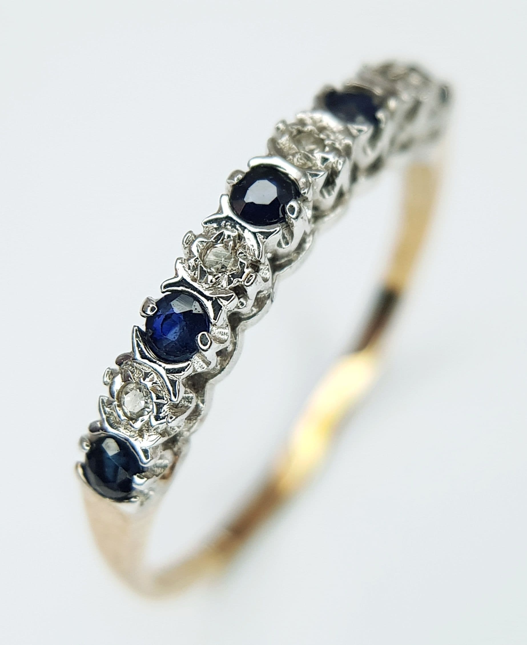 A 9K Yellow Gold Diamond and Sapphire Ring. Size M 1/2. 1.25g.