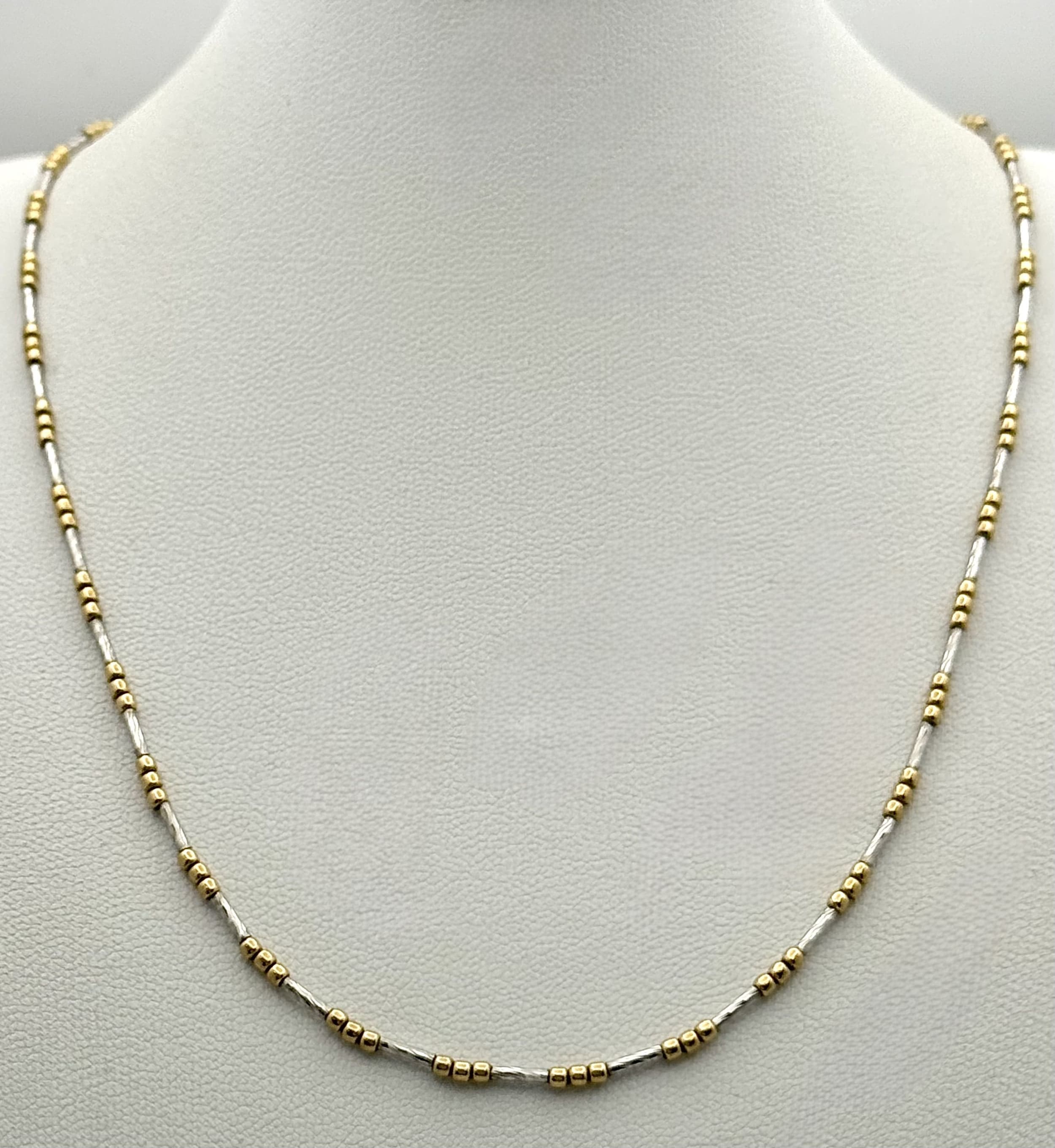 A 9K Yellow and White Gold Fancy Chain Necklace. 42cm. 4.7g