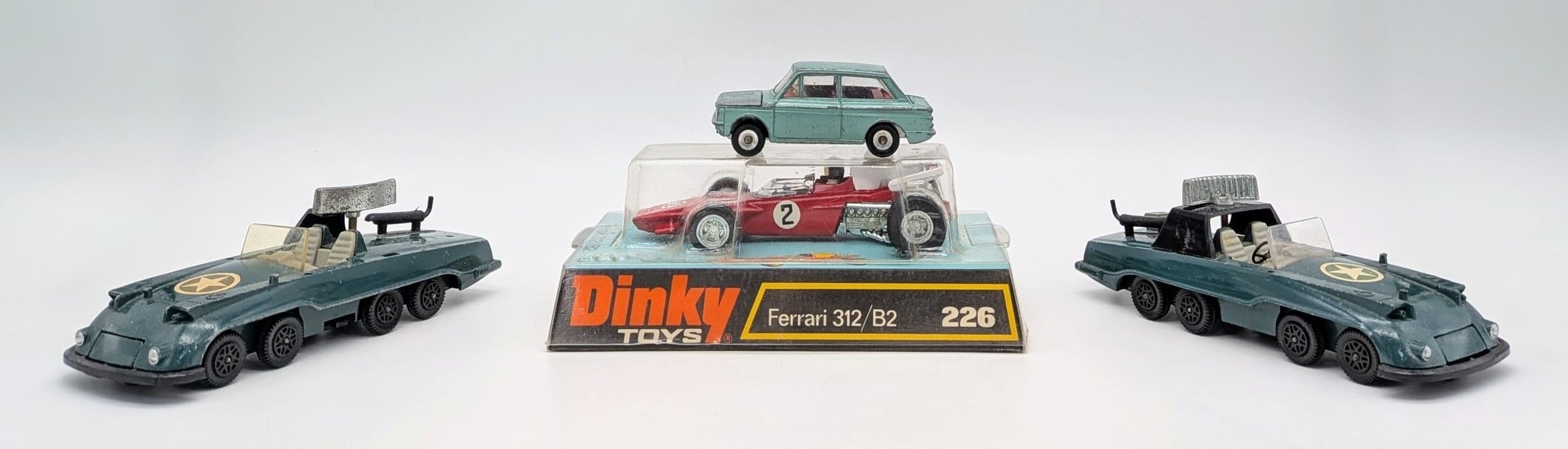 A vintage Dinky toys Ferrari 312/B2. In original bubble pack with card base. Very good condition. Never been out of the pack.. Comes with three other Dinky toys.