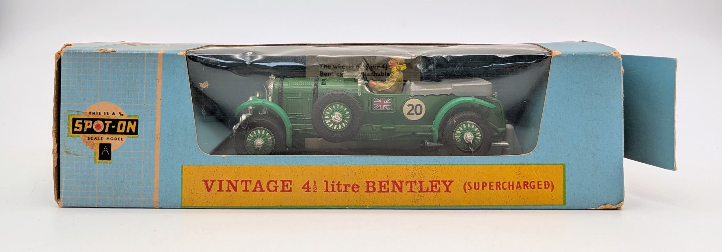 A vintage Tri Ang Spot On 263, Bentley 41/2 litre supercharged. Complete in original box. Packet with spare hubs still stapled to inside of box. Box has some wear. Nice condition.