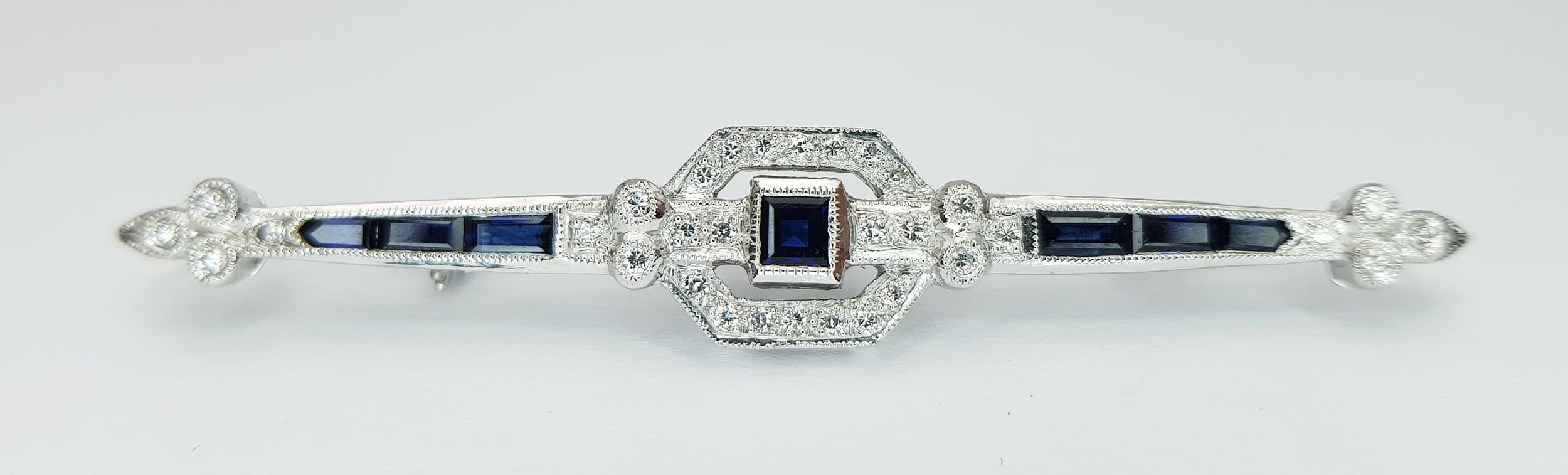 An 18K White Gold, Vintage, Diamond And Sapphire Set Bar Brooch. 6.3G. Sc 3087