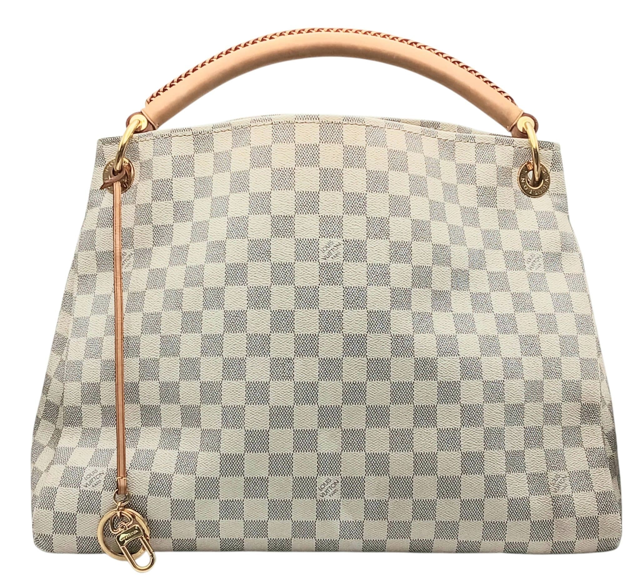 A Louis Vuitton Damier Azur Artsy MM Shoulder Bag. Damier Azur coated canvas exterior with leather braided top handle, gold-toned hardware, protected base studs and detachable Louis Vuitton charm holder. Beige textile interior with one main compartment, multiple open side pockets and a zipped side pocket. Approx 40cm length x 32cm height x 18cm depth. Some patina, marks and wear to the leather. Comes with a certificate of authenticity and purchased receipt. Please see photos or request a condition report. Ref: 28682.