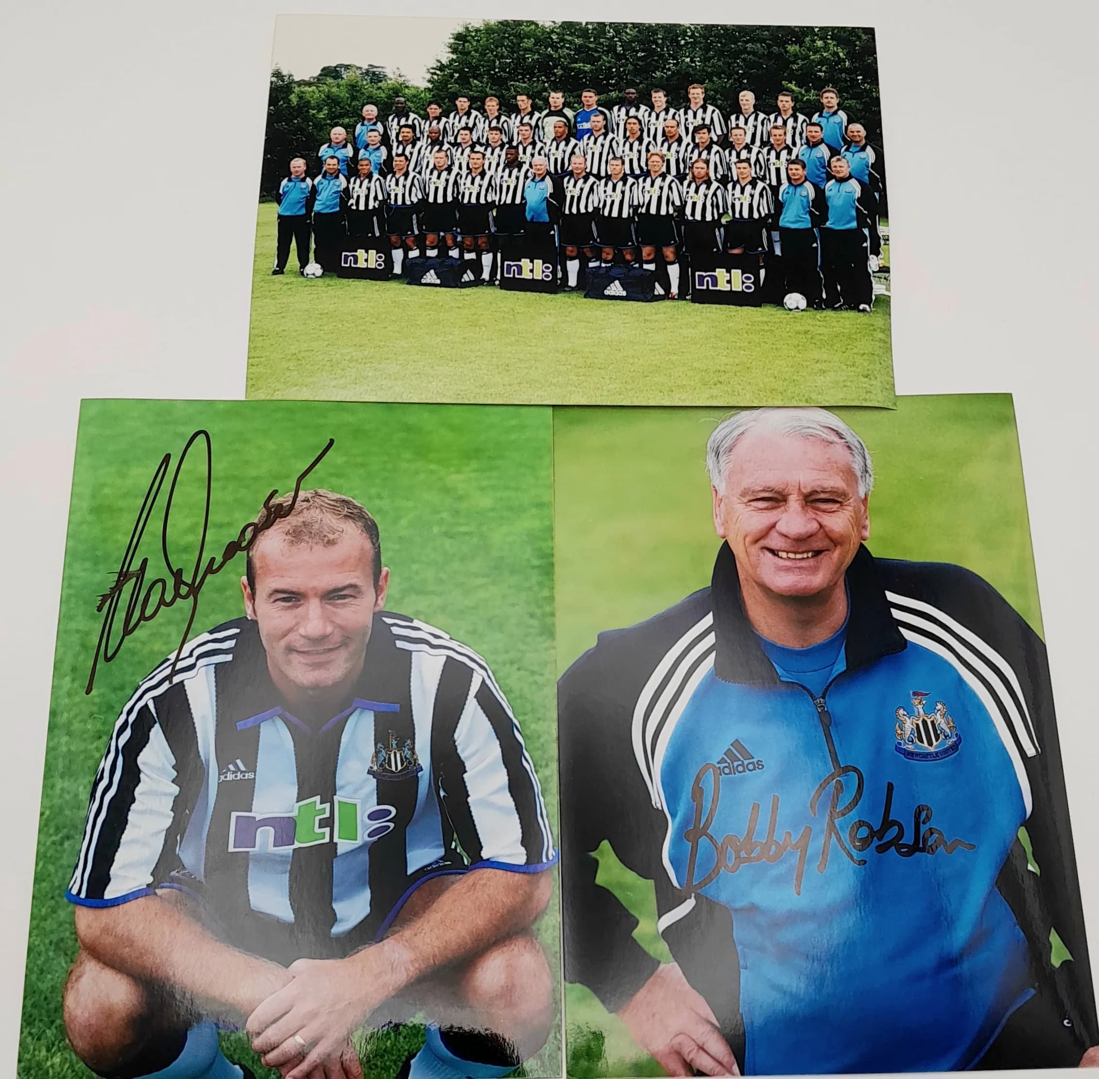A Signed Bobby Robson and Alan Shearer Photograph. Taken and signed in the late 1990s. Comes with a Newcastle squad photo as well. Original signatures. 18 x 13cm.