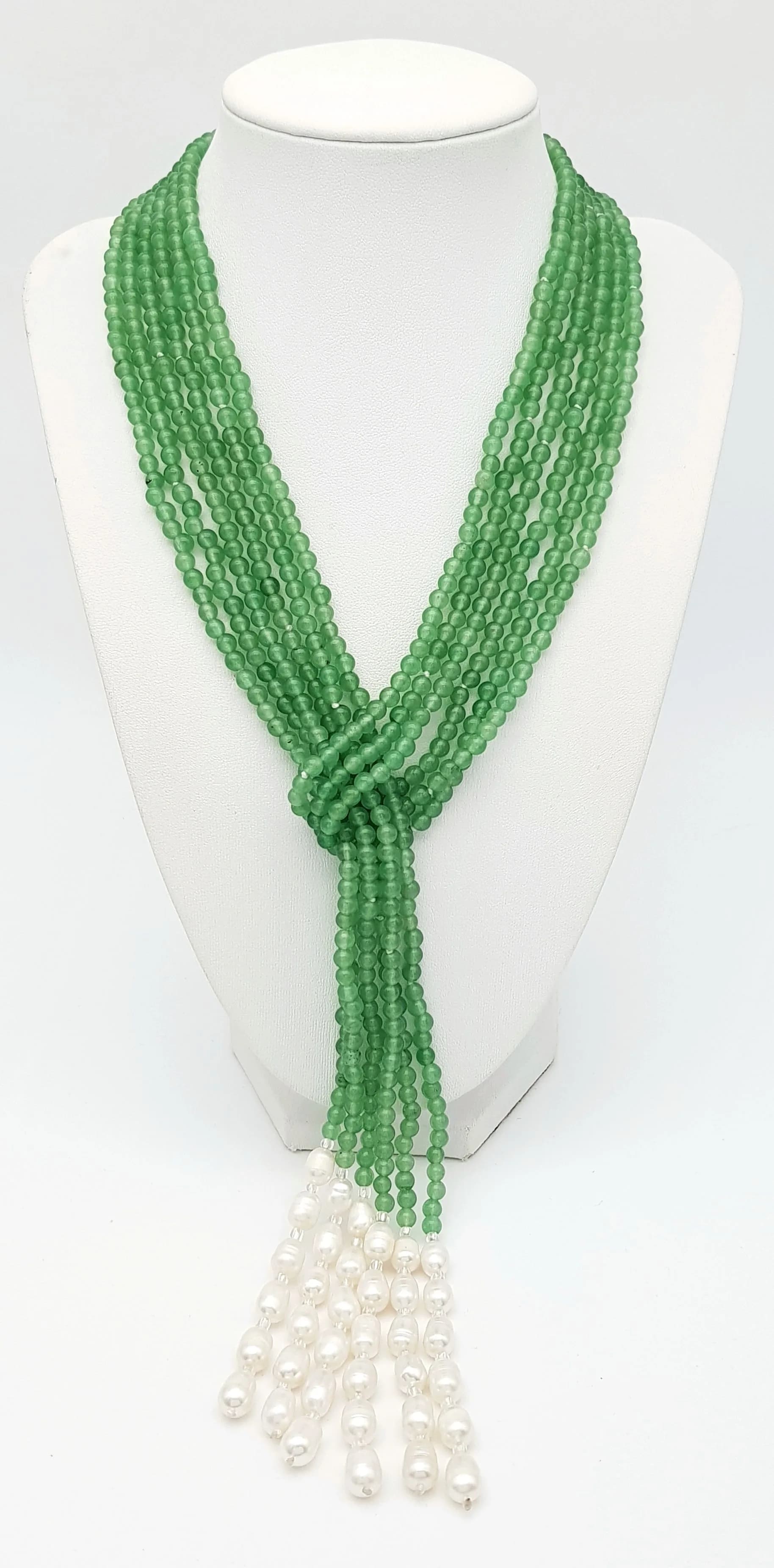 A Beautiful Three Strand Pale Green Jade and Pearl Scarf Necklace. 4mm beads with 6/7mm pearls. Each separate strand is c.125cm.