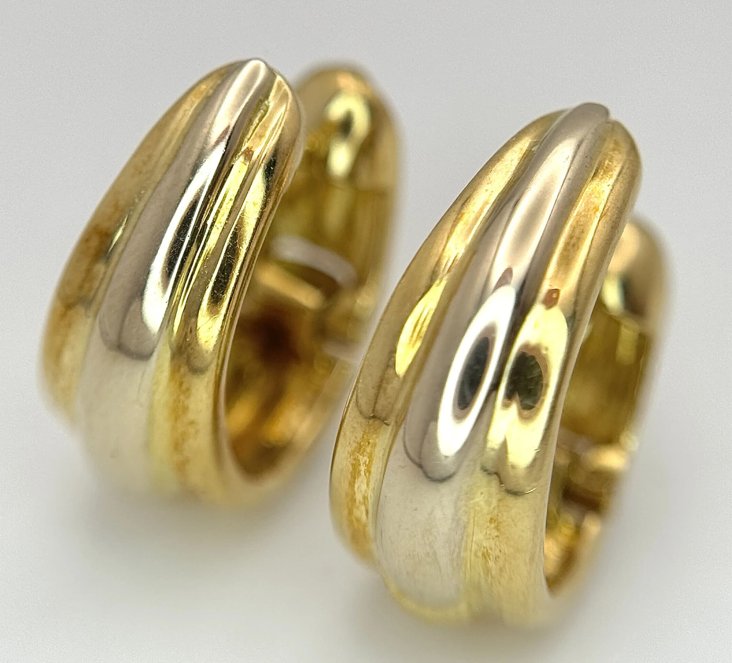 A Pair of Italian 18K Yellow Gold Huggie Earrings. 6.7g total weight.