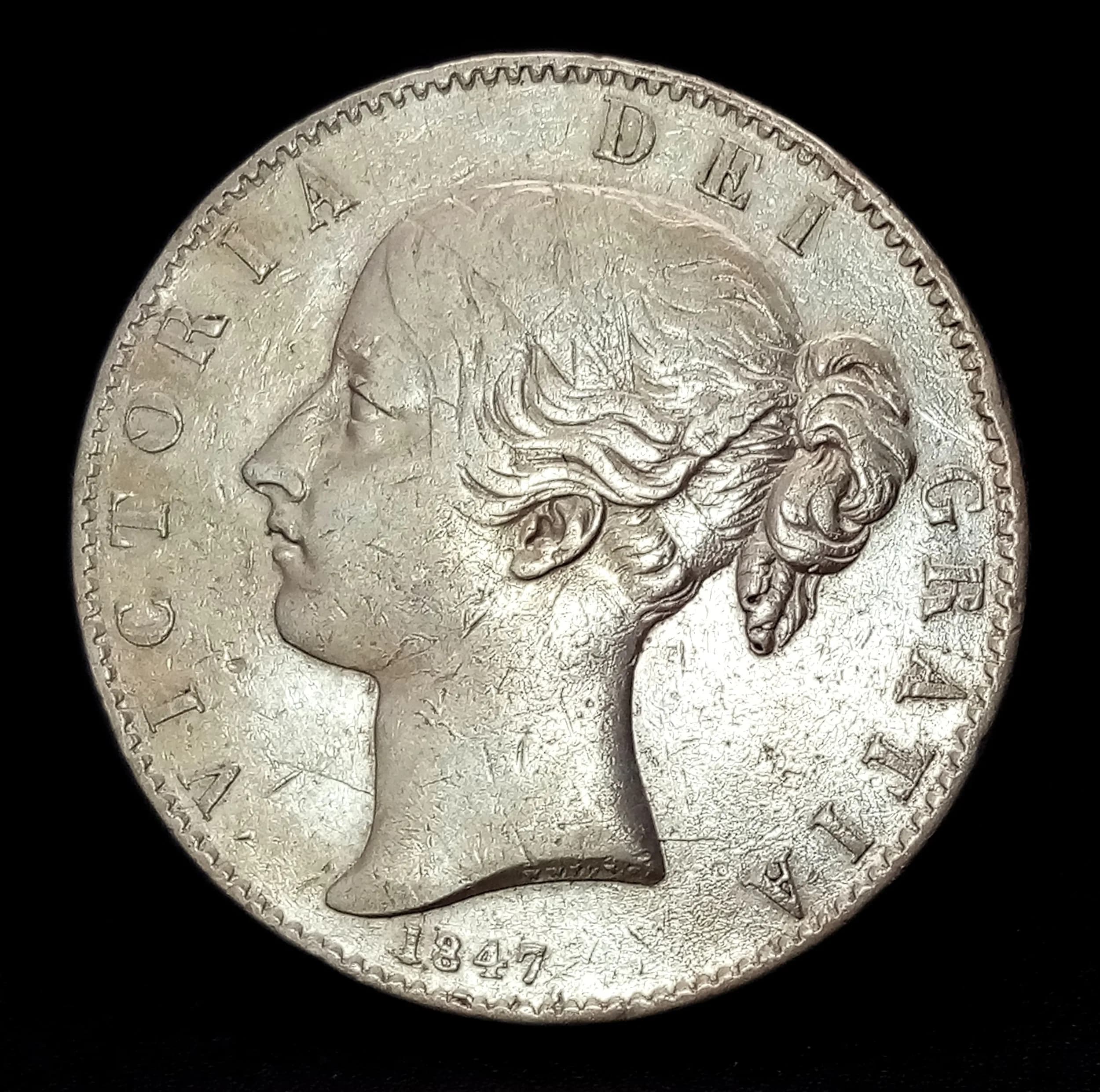 A High Grade 1847 Queen Victoria Young Head Silver Crown Coin. Obverse with young head portrait of Queen Victoria, reverse with crowned shield within wreath. Dated 1847.