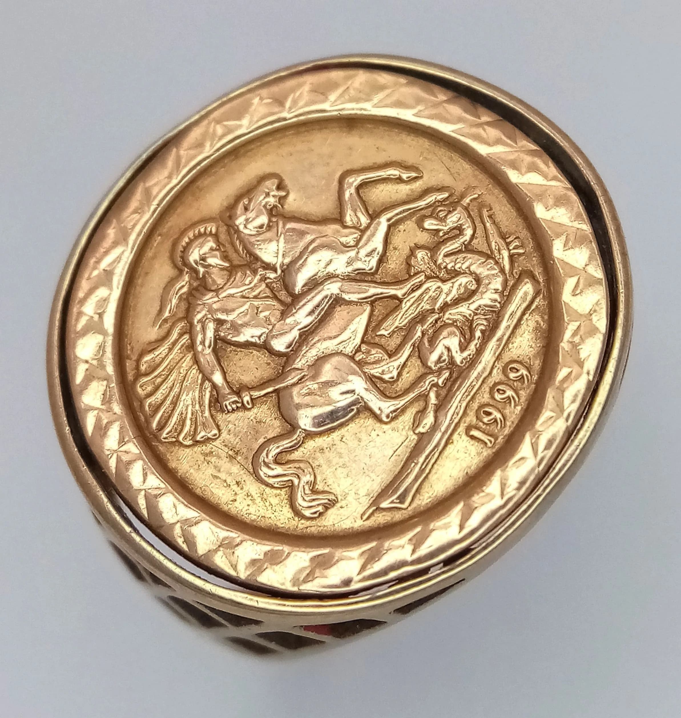 A 9K GOLD ST GEORGE RING . 2.2gms size N