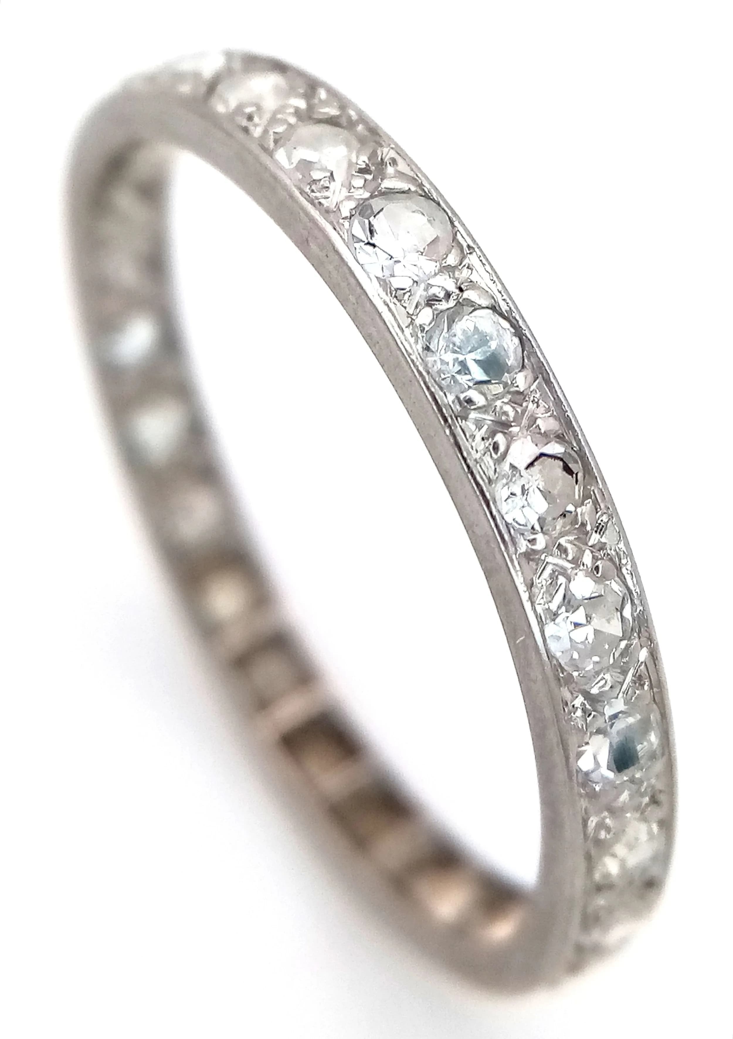 A PLATINUM, DIAMOND SET, FULL ETERNITY RING. 0.60CTW. 2.6G, SIZE R. SC 5100