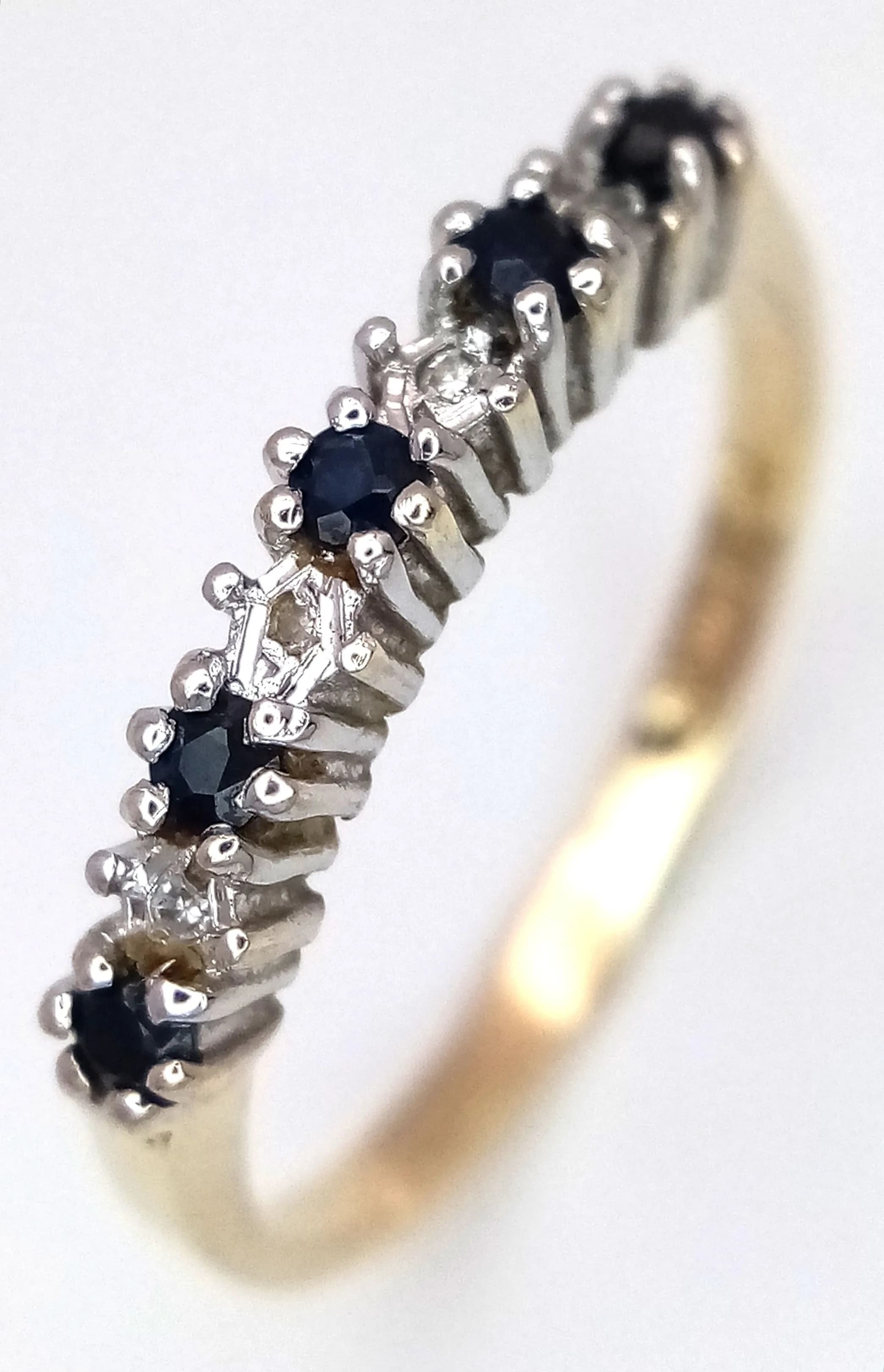 A 9K YELLOW GOLD, DIAMOND AND SAPPHIRE SET, HALF ETERNITY RING. 1.8G, SIZE P. SC 5034
