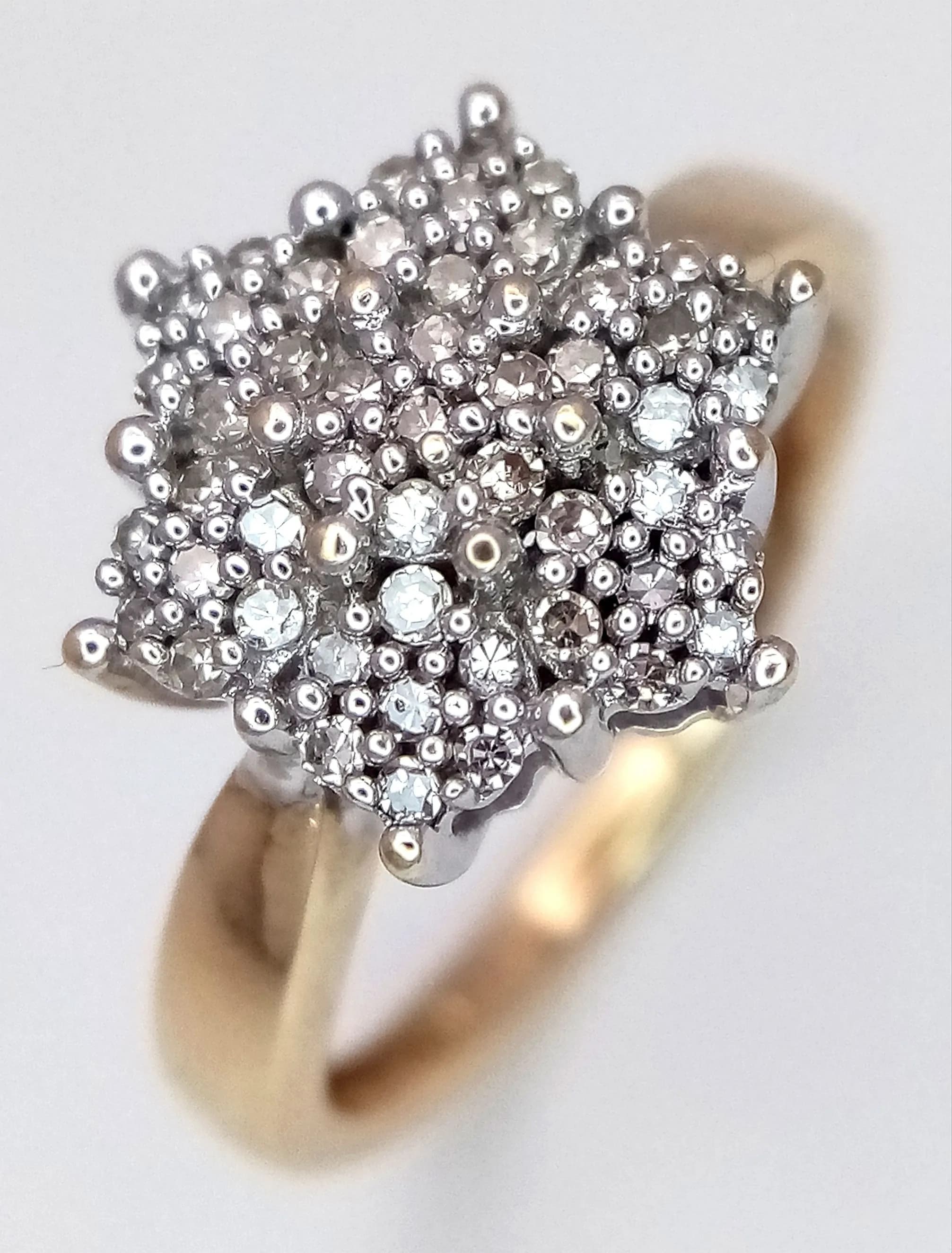 A 9K YELLOW GOLD, DIAMOND SET, CLUSTER RING. 0.30CTW. 2.2G, SIZE J. SC 5015