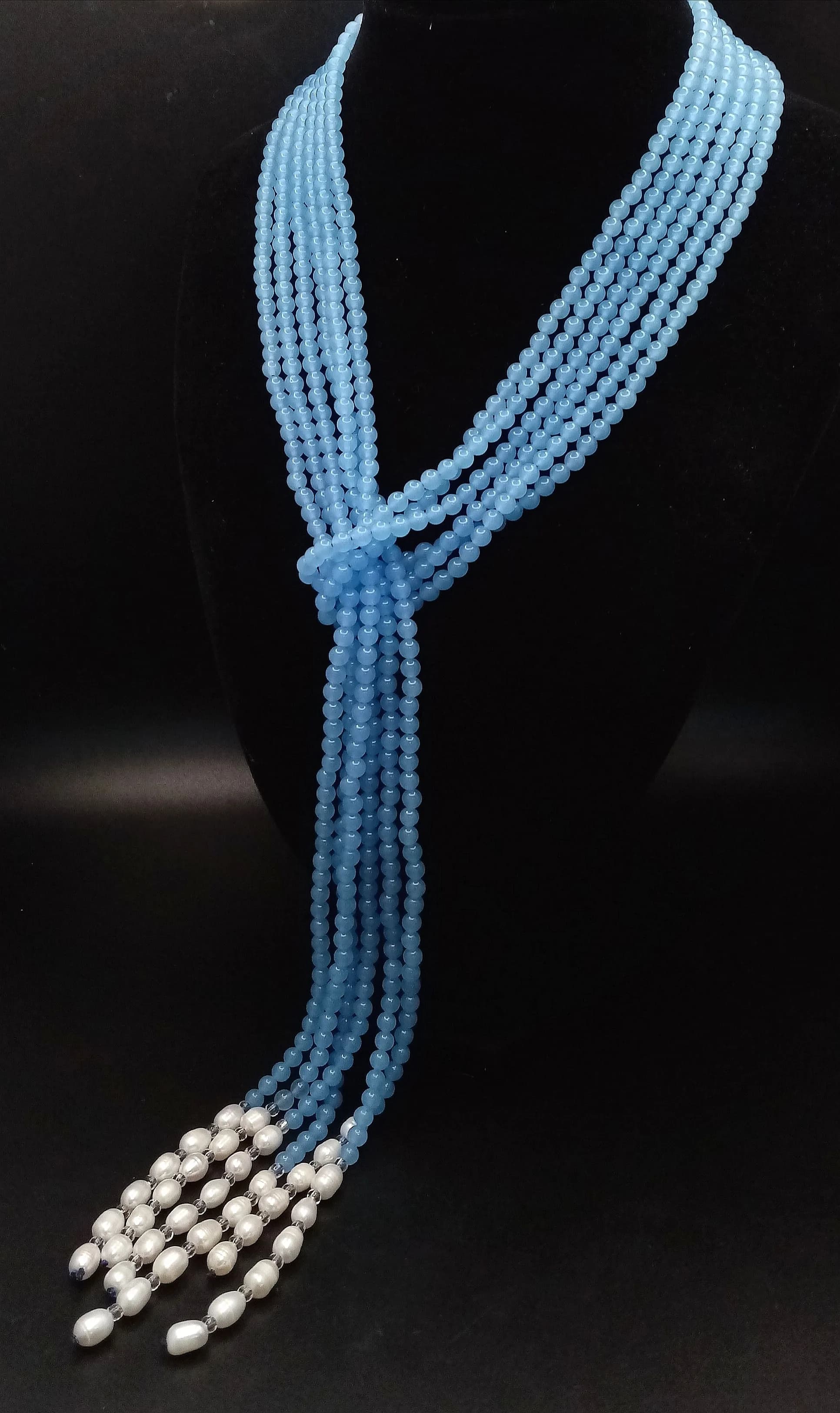 An Aquamarine Bead and Freshwater Pearl Three Strand Scarf Necklace. 120-125cm strands.