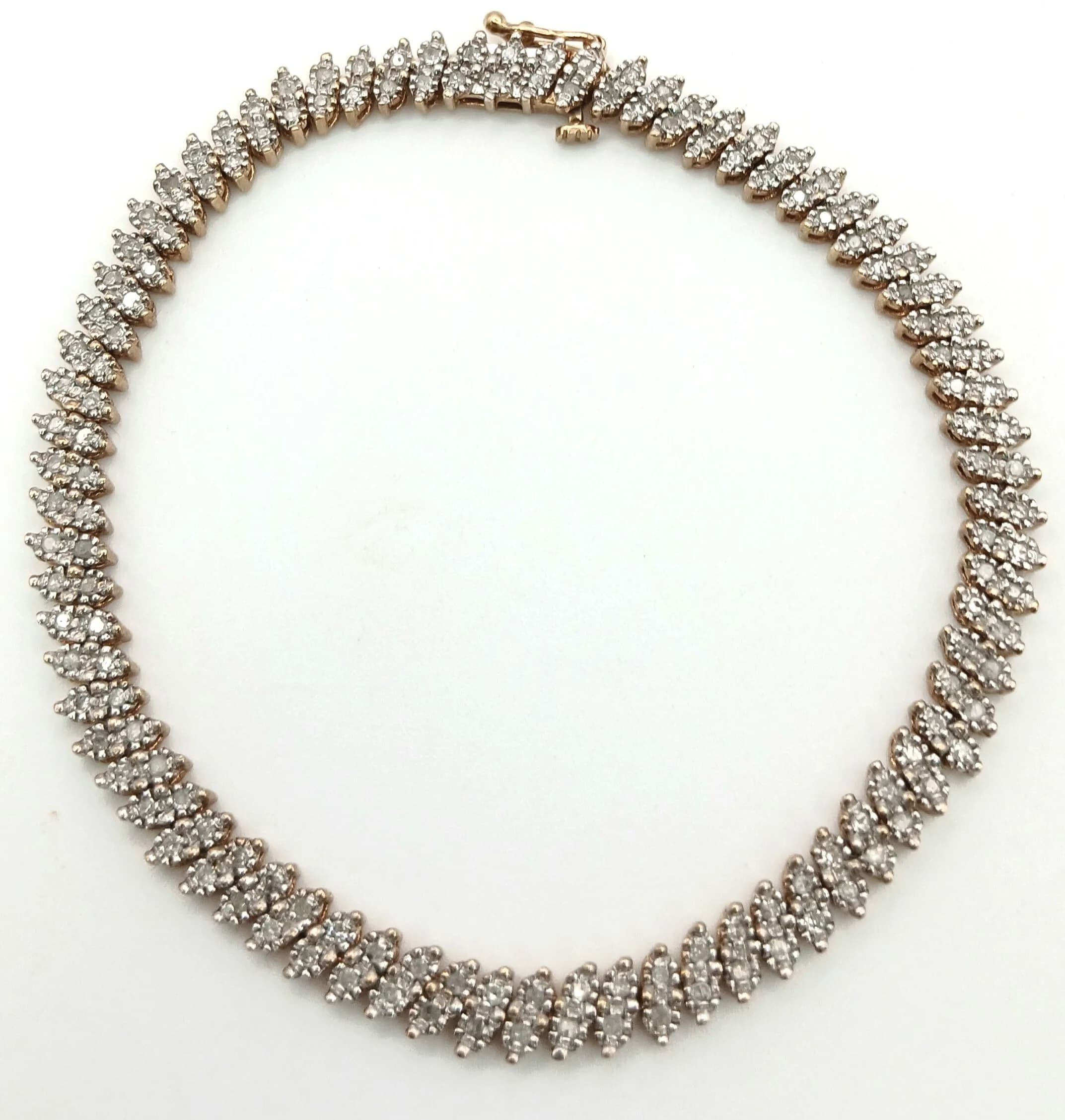 A 9K YELLOW GOLD, DIAMOND SET BRACELET. 0.75CTW. 9.5G. SC 5021
