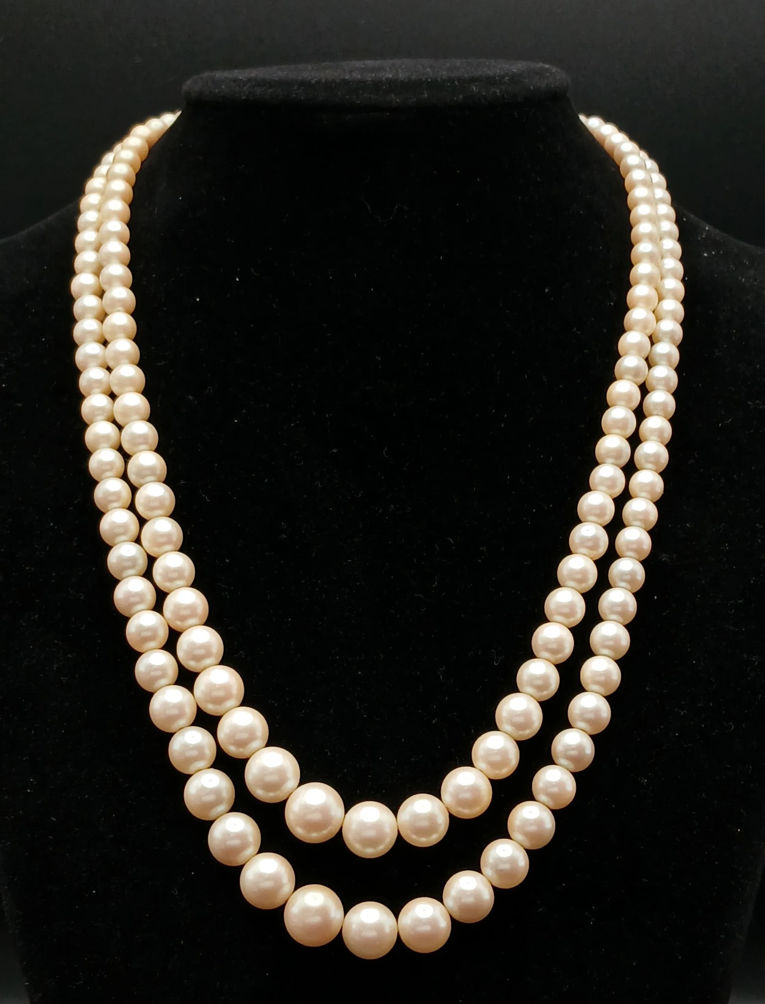 A VINTAGE(1950'S) SET OF SIMULATED PEARLS IN A GRADUATED TWIN CHOKER STYLE AND IN THE ORIGINAL BOX .