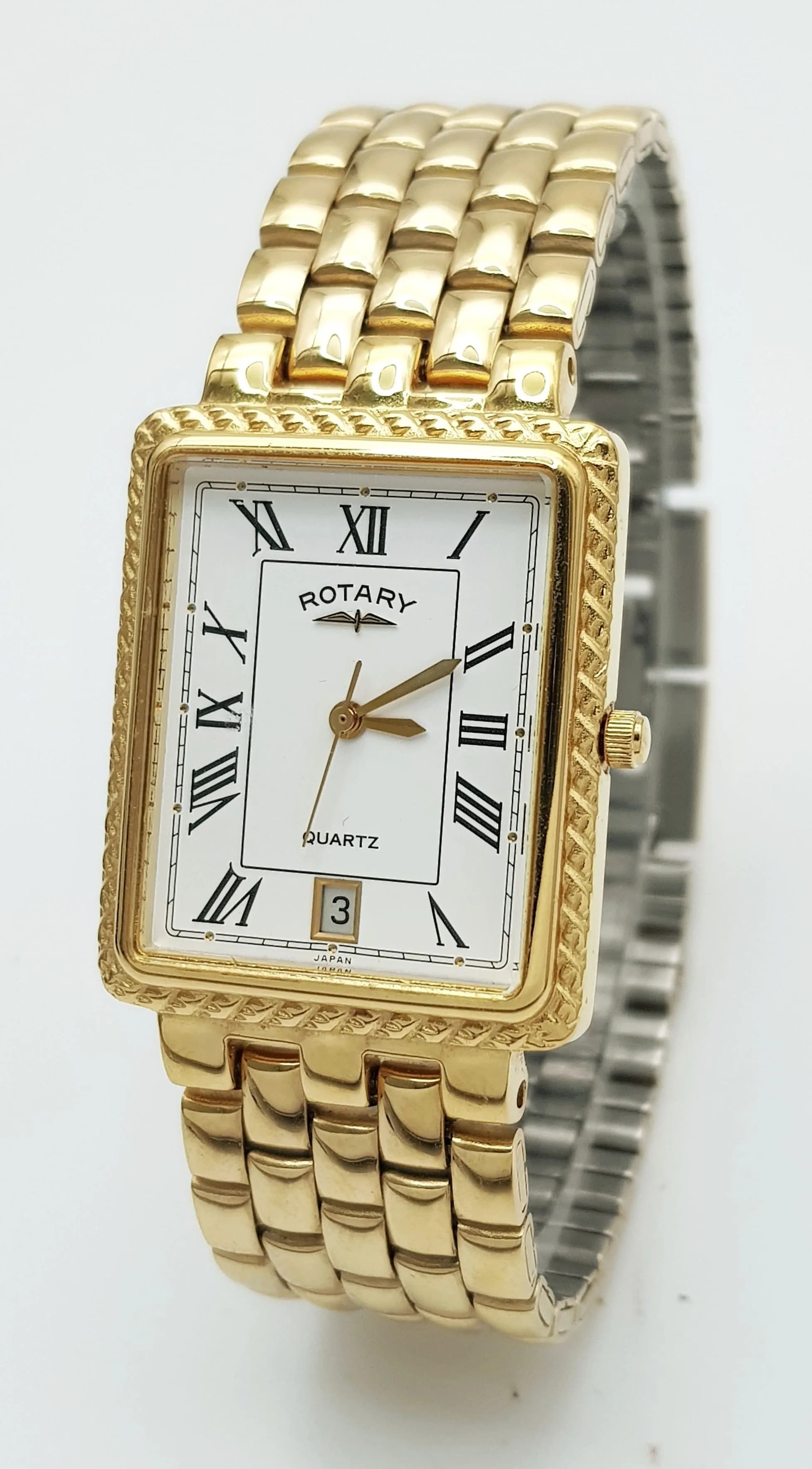 A LADIES GOLD PLATED ROTARY WATCH WITH SQUARE DIAL, ROMAN NUMERALS , DATE BOX AND QUARTZ MOVEMENT , COMING IN ITS ORIGINAL BOX WITH GUARANTEE PAPER .(NEEDS BATTERY)