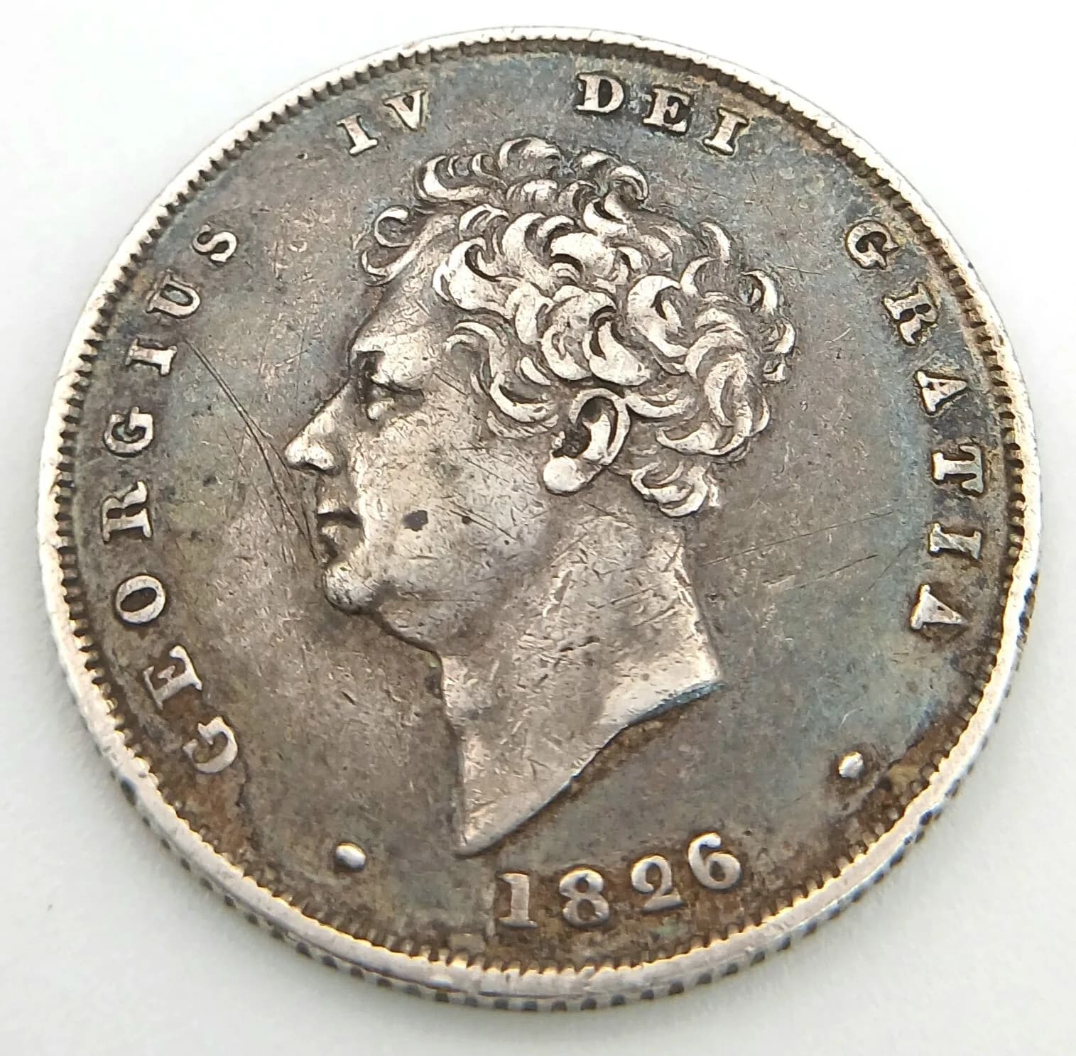 An 1826 George IV Silver Shilling Coin.