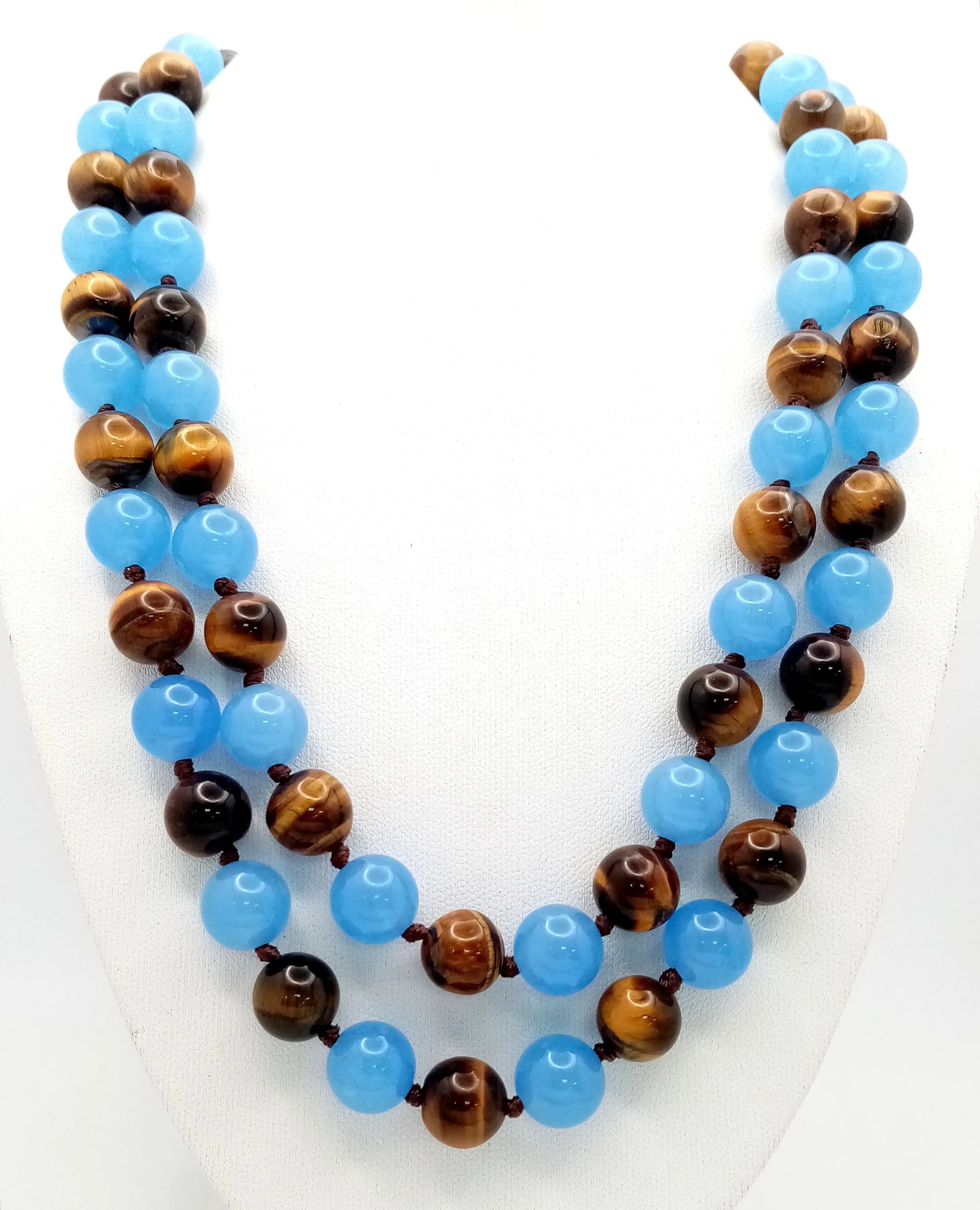 A Blue Jade and Tigers Eye Beaded Matinee Length Necklace. 10mm beads. 90cm length.