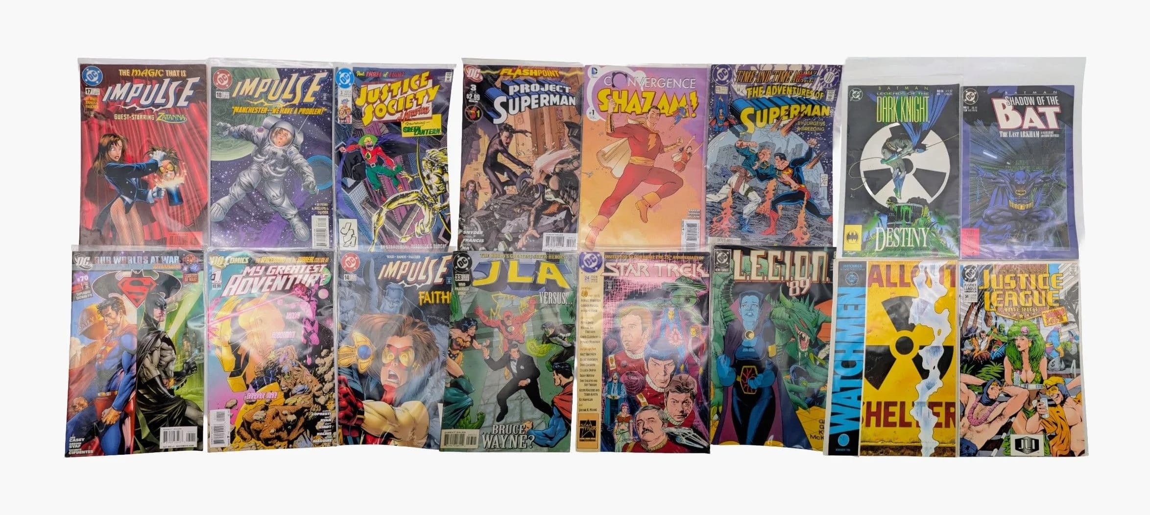 Sixteen DC Mixed Comics. All plastic wrapped. Please refer to photos for finer details.