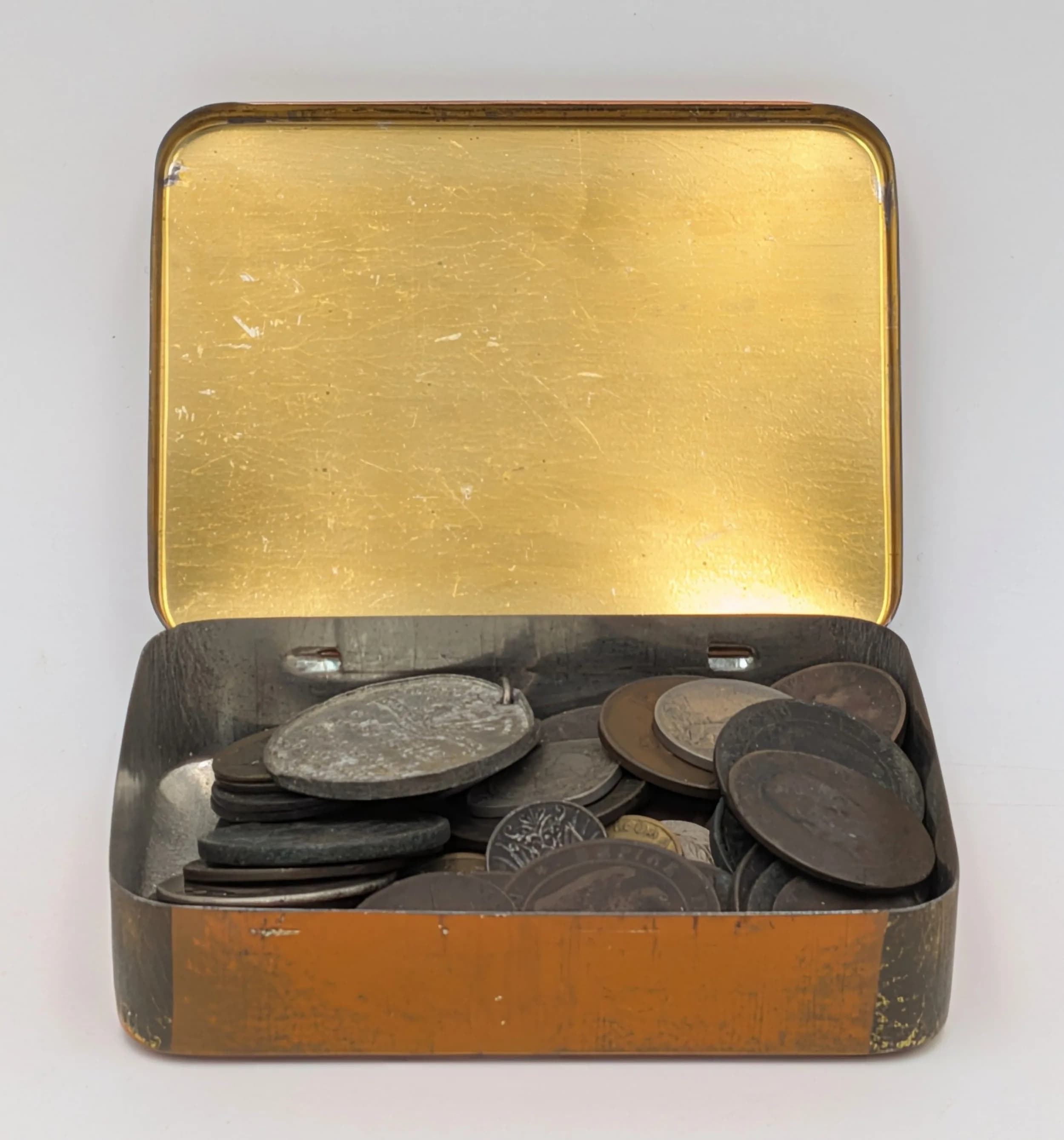 A Tobacco Tin Full of Interesting Odd Coins.