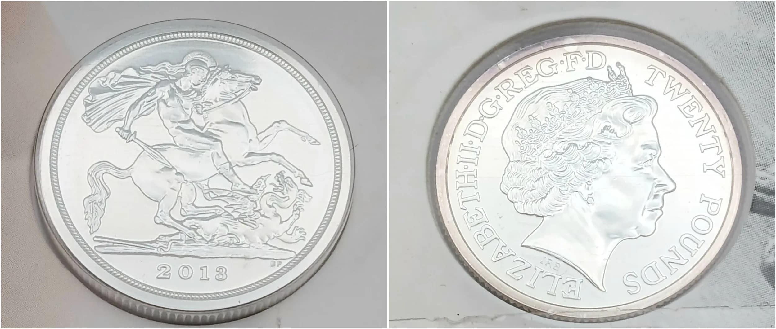 A Mint Sealed Condition Fine Silver £20 Coin-2013 dated and titled ‘A Timeless First’- 999 silver 15.71 grams as issued by the Royal Mint.