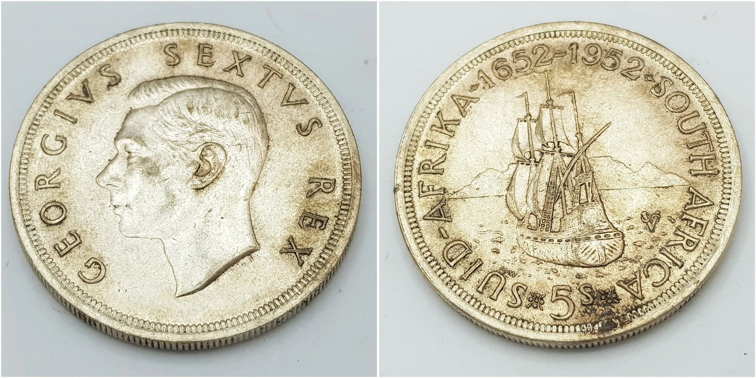 A 1952 Almost Uncirculated Condition South African Silver 5 Shilling Coin commemorating 300 th Anniversary of the Founding of Capetown. 28.46 grams. Graded on the Sheldon Scale.