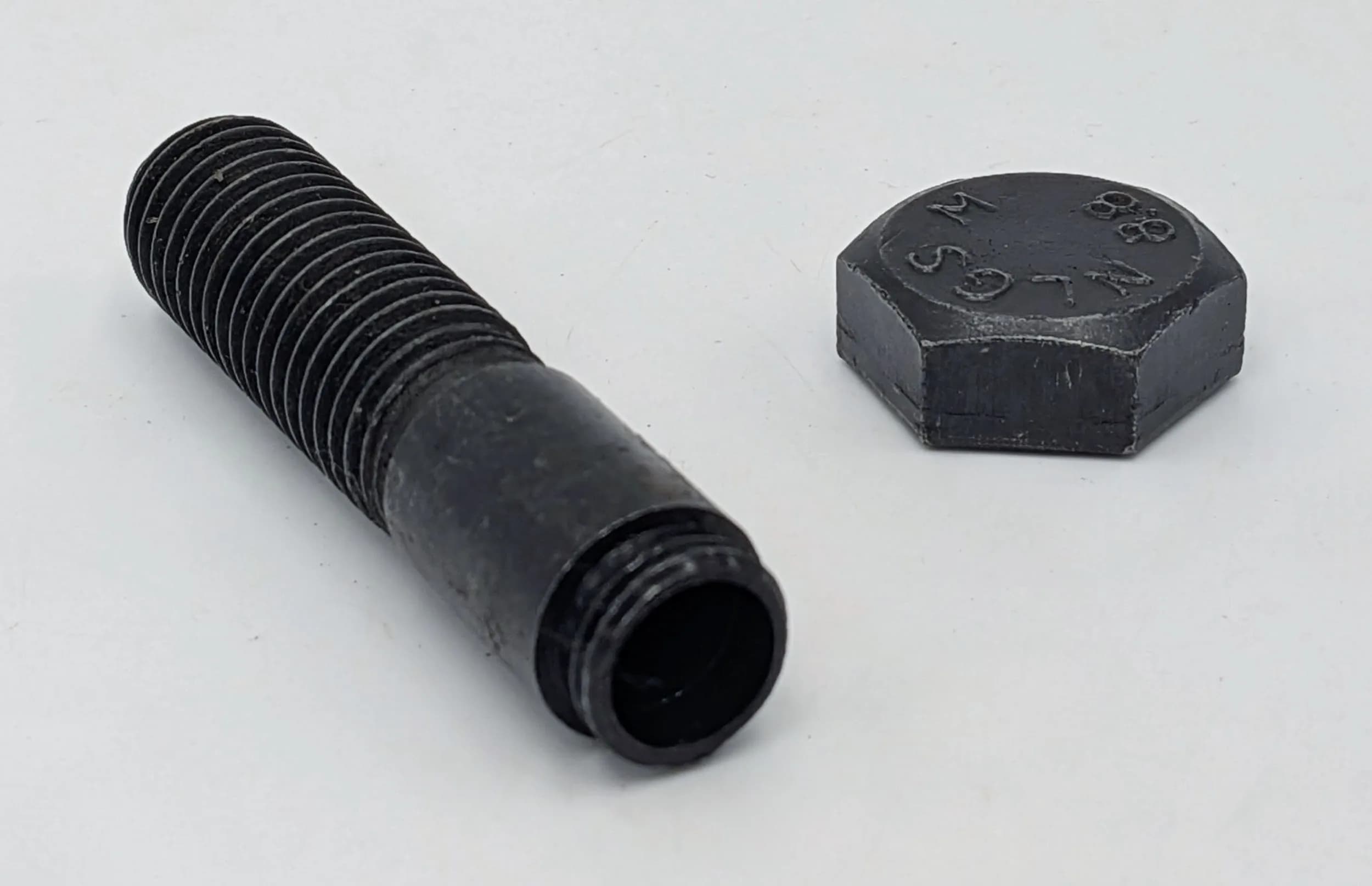WW2 SOE/OSS Message Bolt. A standard bolt with a hollowed-out centre. The top unscrews to reveal a void for hiding messages, film, etc. These would have been part of a farm gate, or something known to agents for dropping off and picking up the contents.