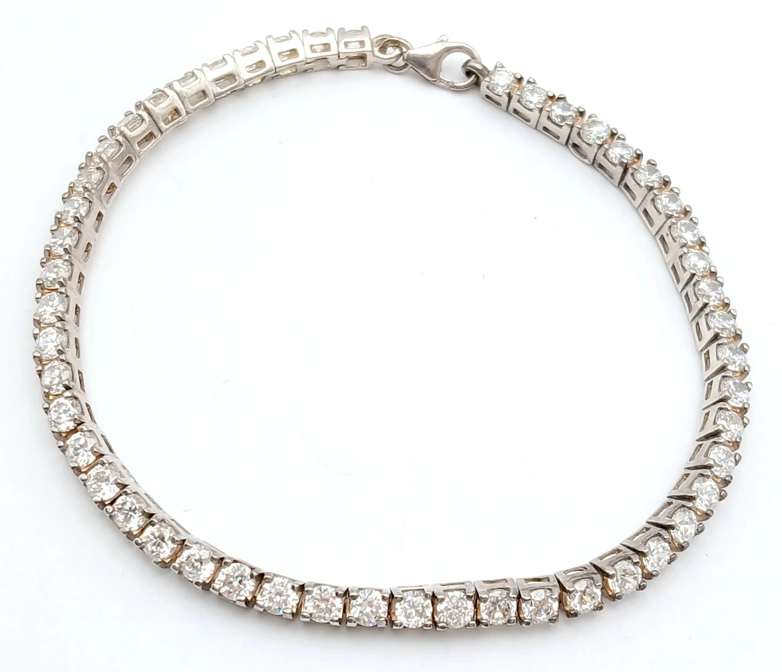A STERLING SILVER, STONE SET, TENNIS BRACELET. 7.5". 10.6G. SC 5141